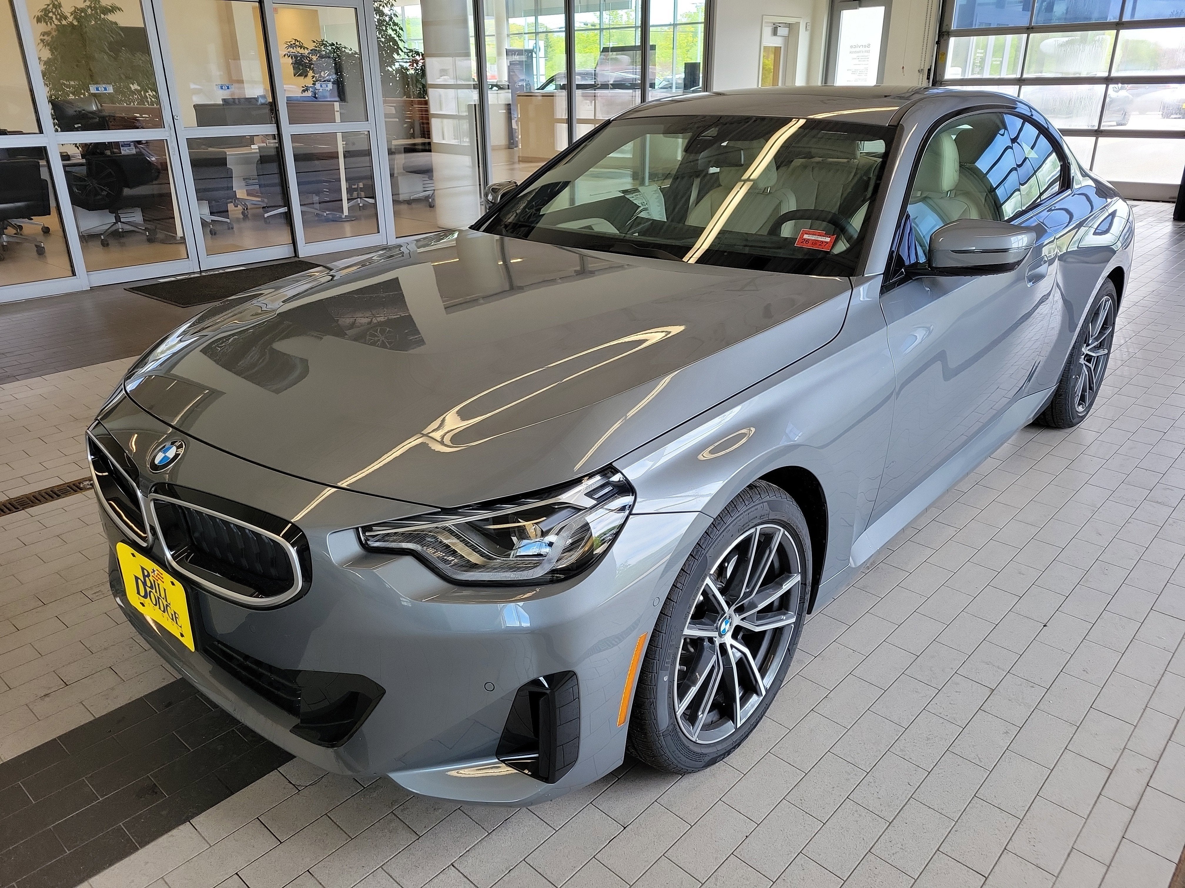 2026 BMW 2 Series 230i xDrive in Skyscraper Grey Metallic — front three-quarter view
