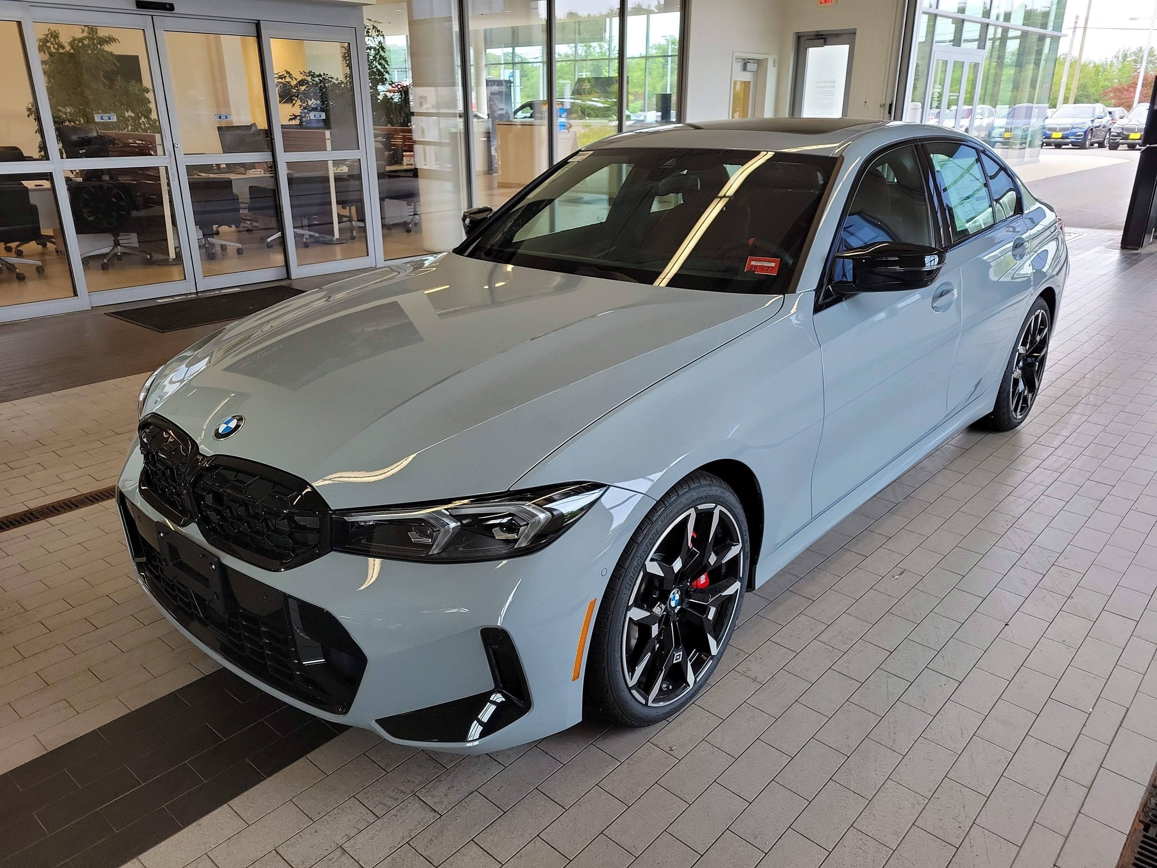 2026 BMW 3 Series M340i NA xDrive in Brooklyn Grey Metallic — front three-quarter view
