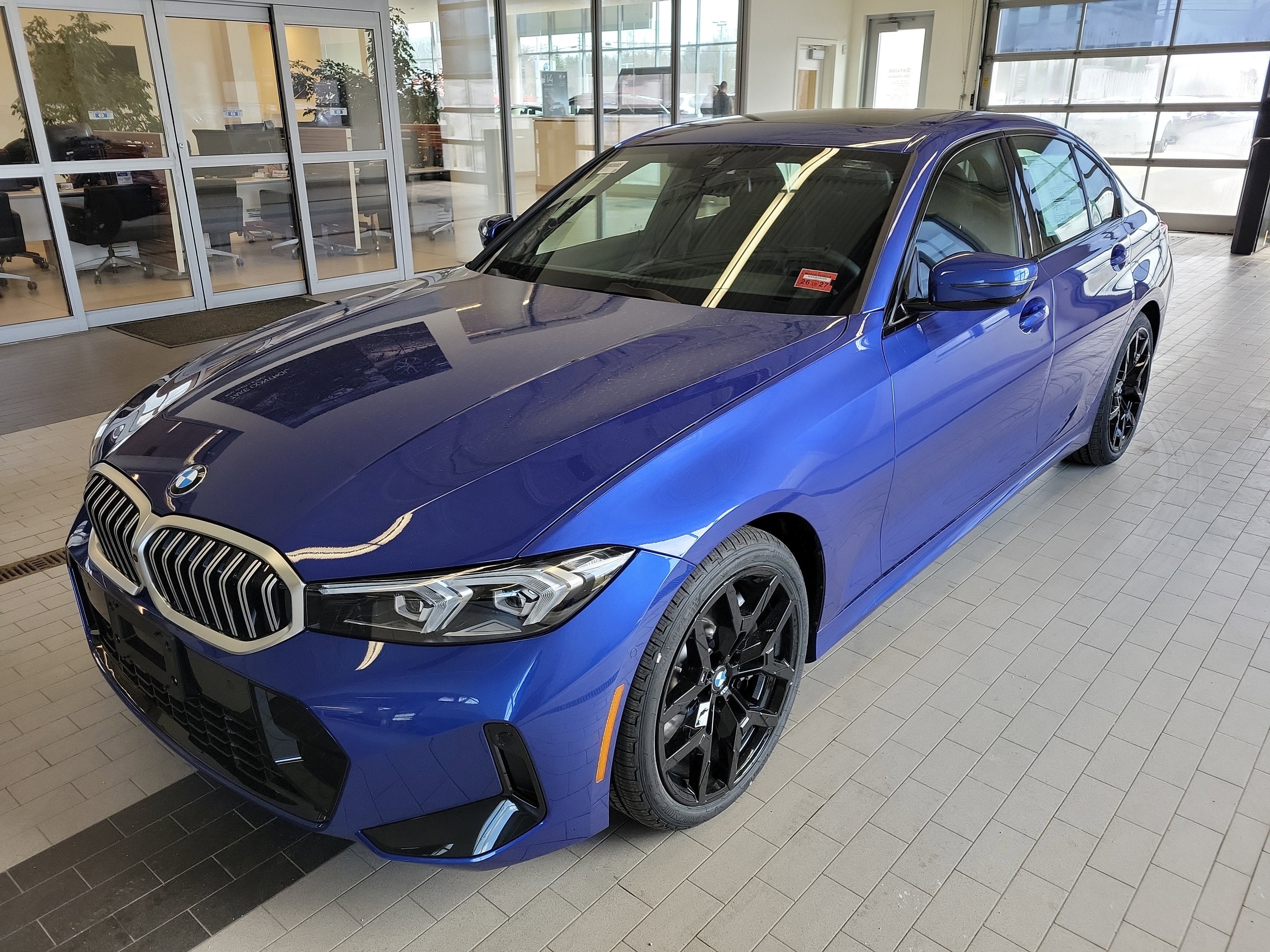 2026 BMW 3 Series 330i NA xDrive in Portimao Blue Metallic — front three-quarter view