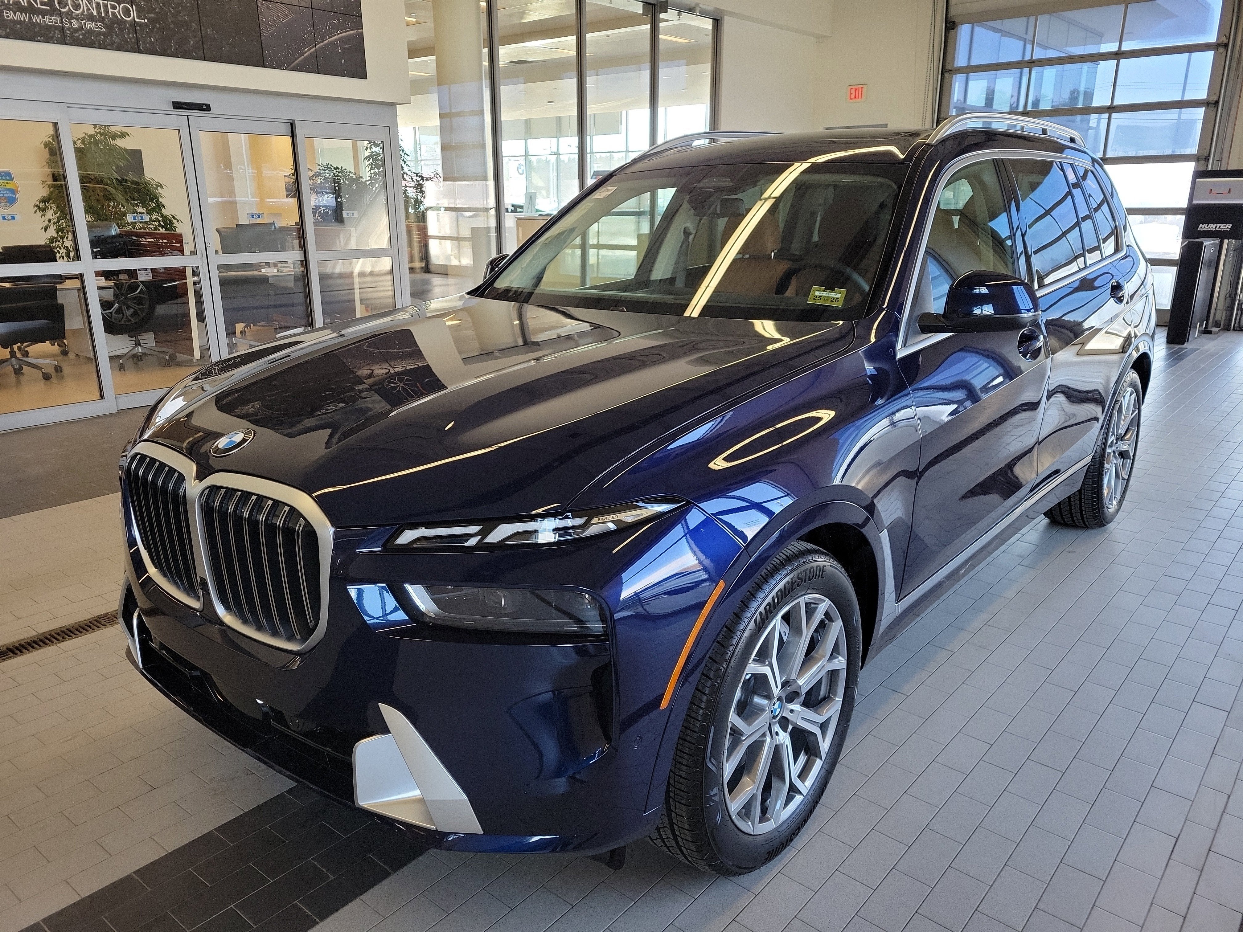 2026 BMW X7 xDrive40i in Tanzanite Blue II Metallic — front three-quarter view