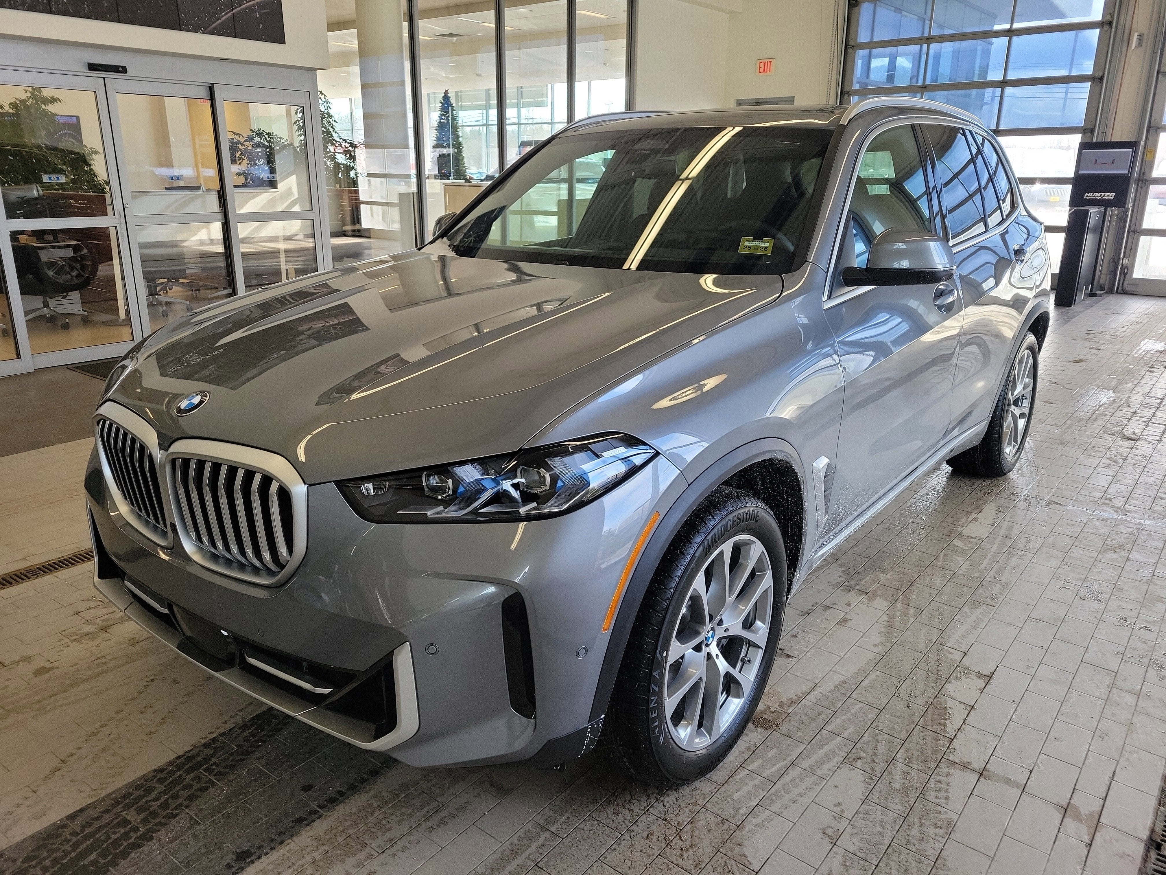 2026 BMW X5 xDrive40i in Skyscraper Grey Metallic — front three-quarter view