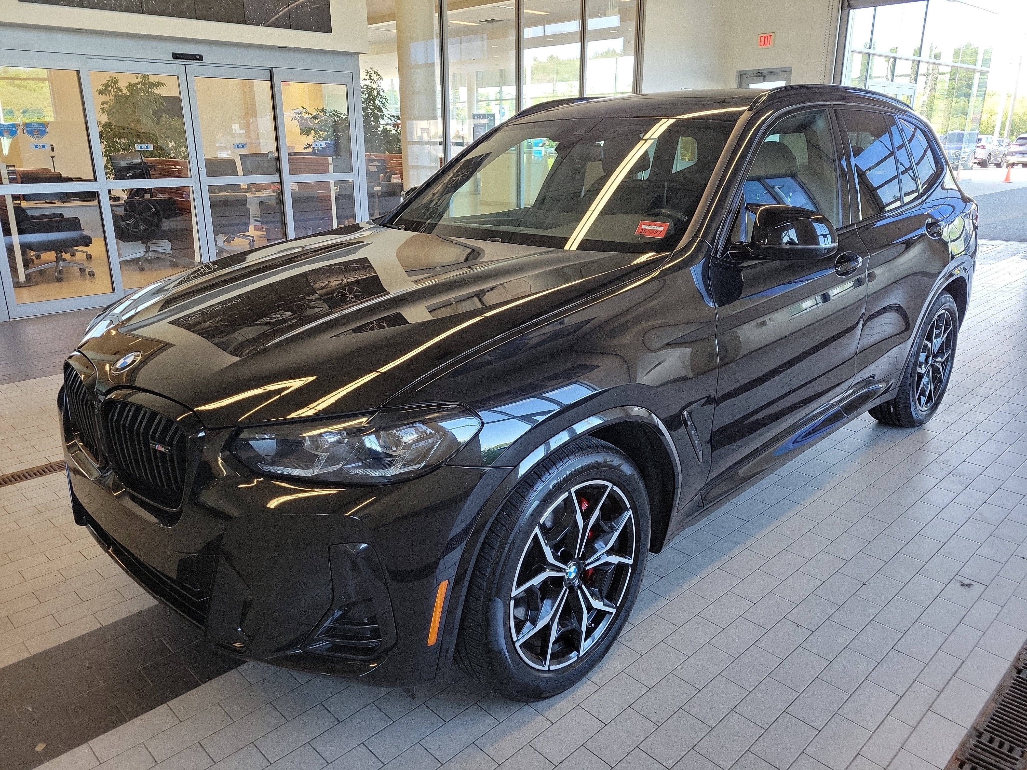 2023 BMW X3 M40i in Black Sapphire Metallic — front three-quarter view