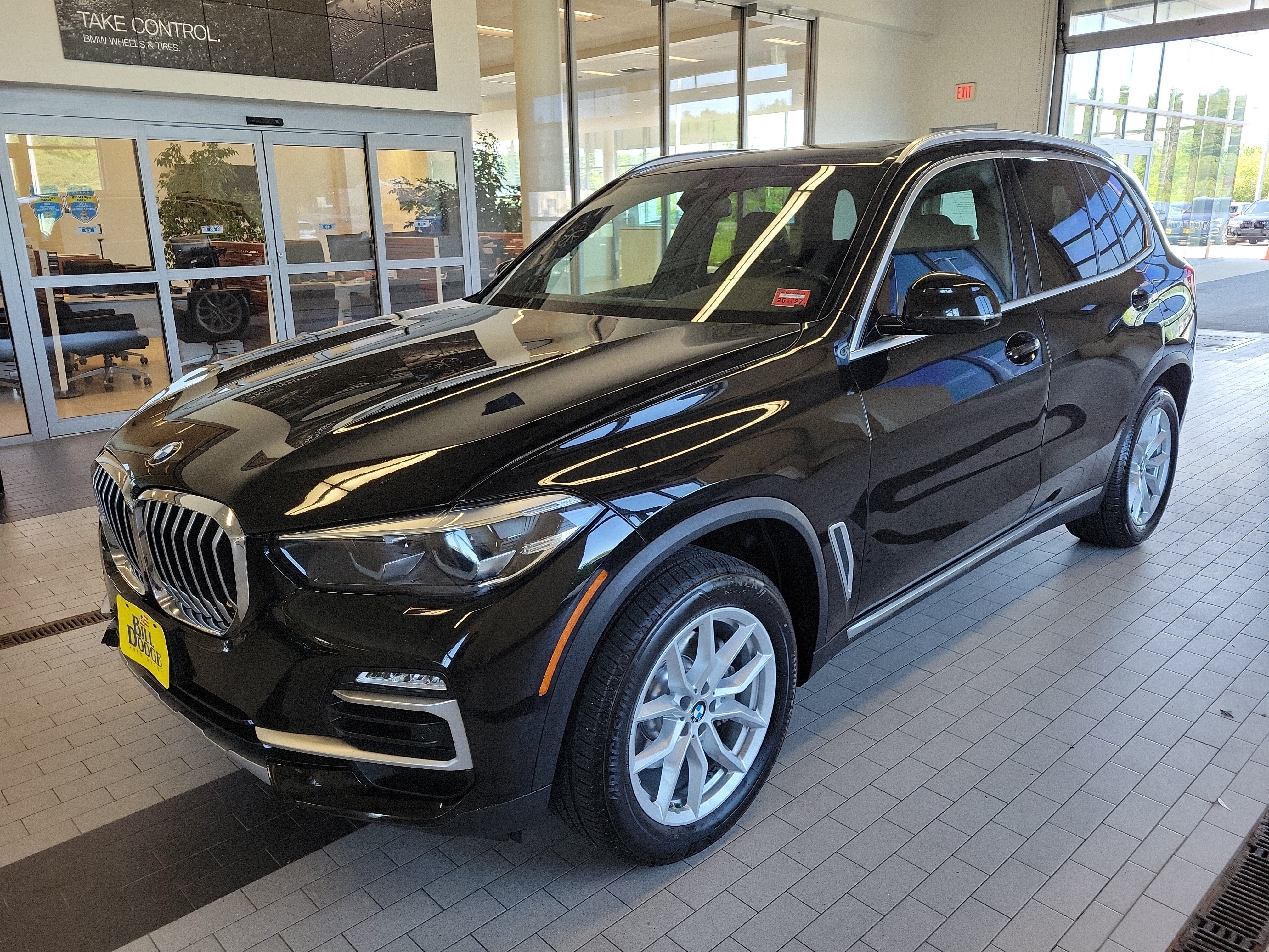 2020 BMW X5 xDrive40i in Jet Black — front three-quarter view