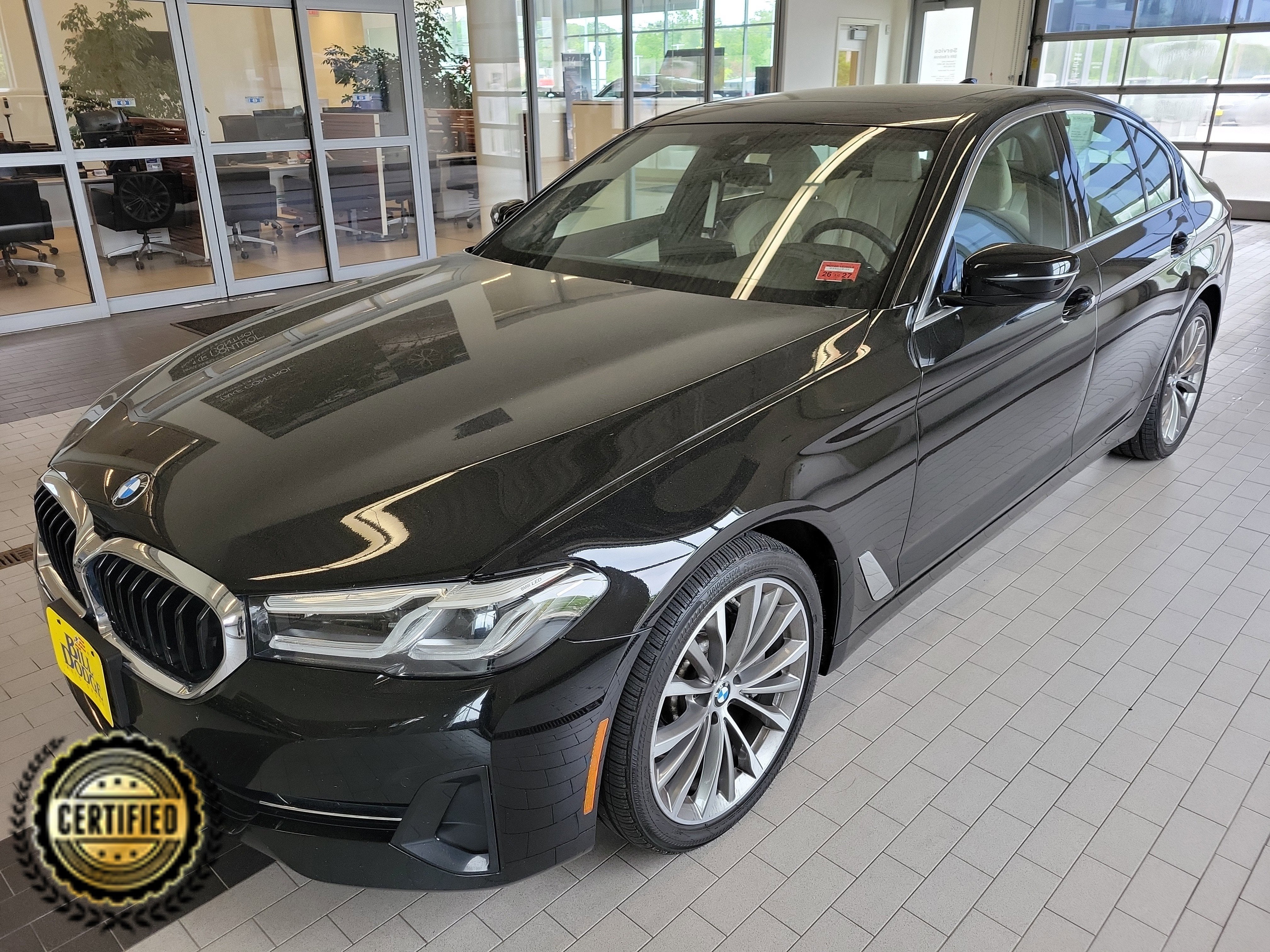 2023 BMW 5 Series 530i xDrive in Jet Black — front three-quarter view