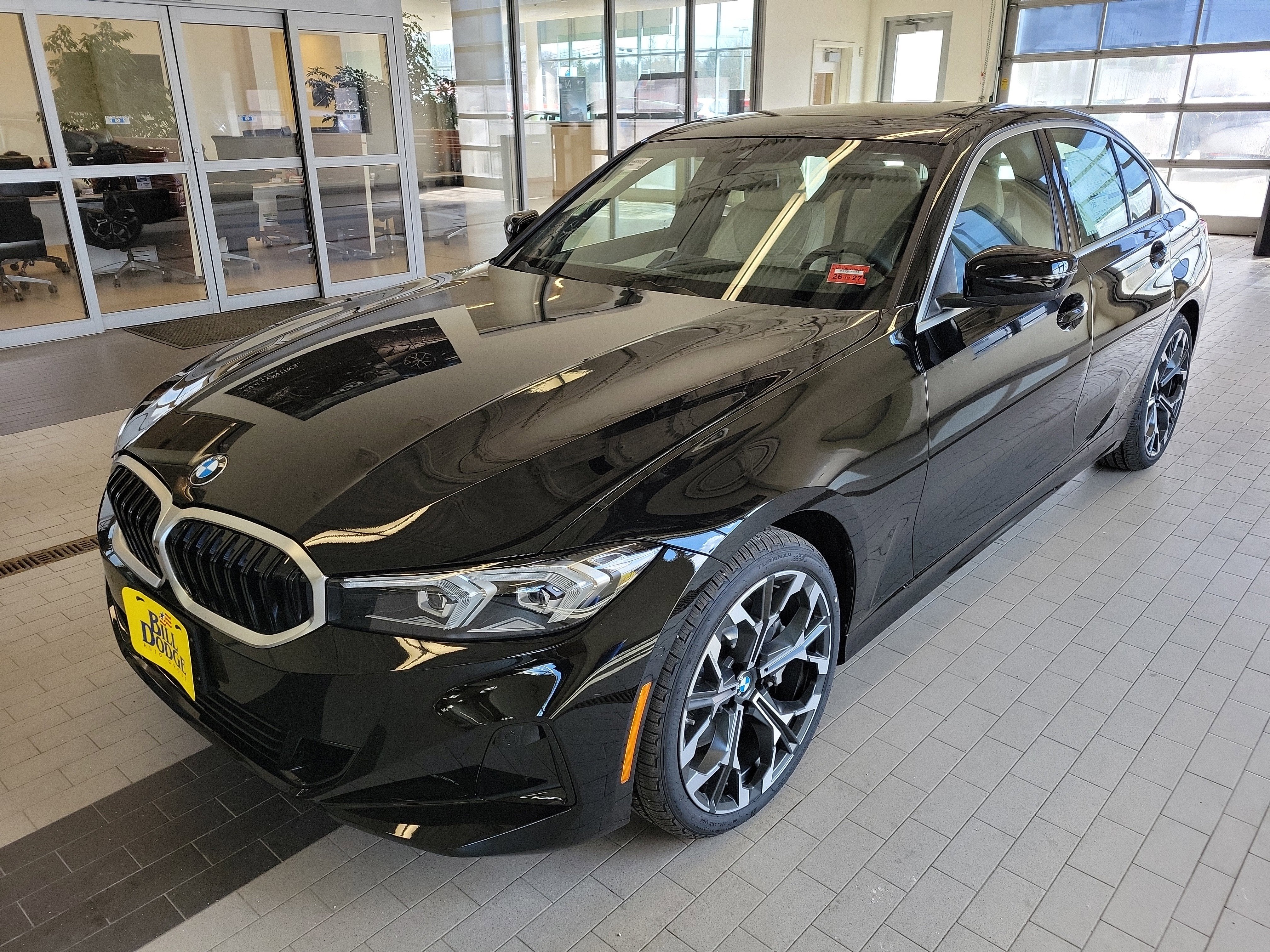 2026 BMW 3 Series 330i xDrive in Jet Black — front three-quarter view