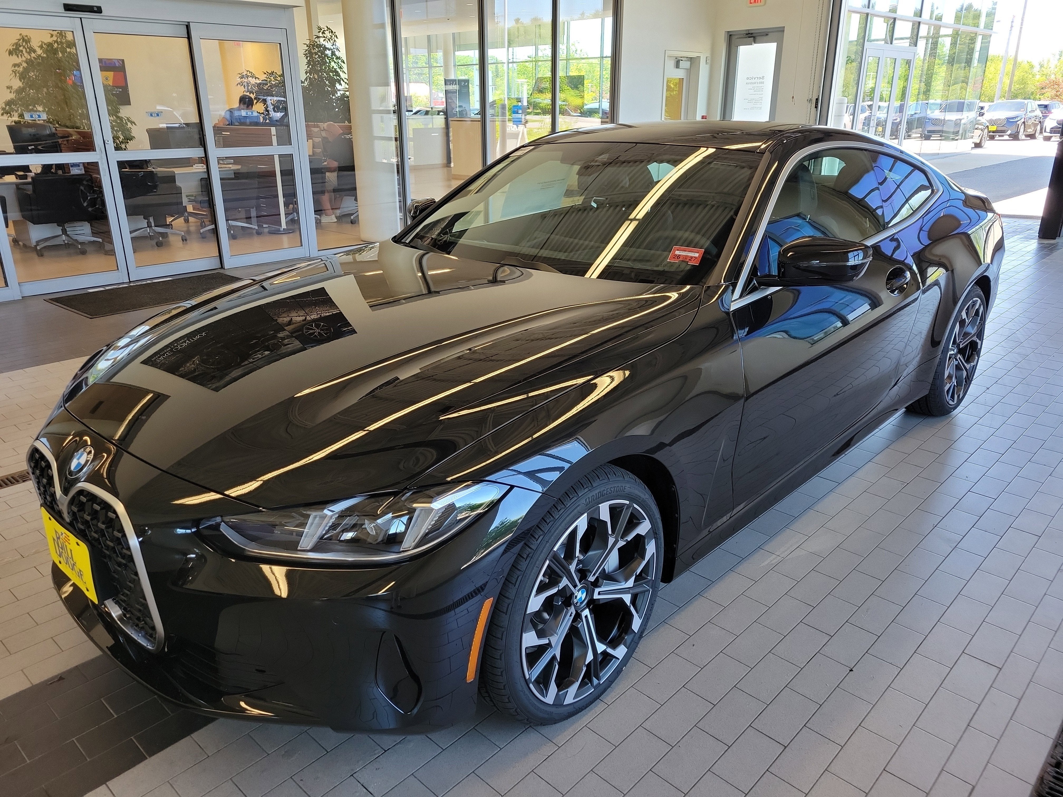 2027 BMW 4 Series 430i xDrive in Black Sapphire Metallic — front three-quarter view