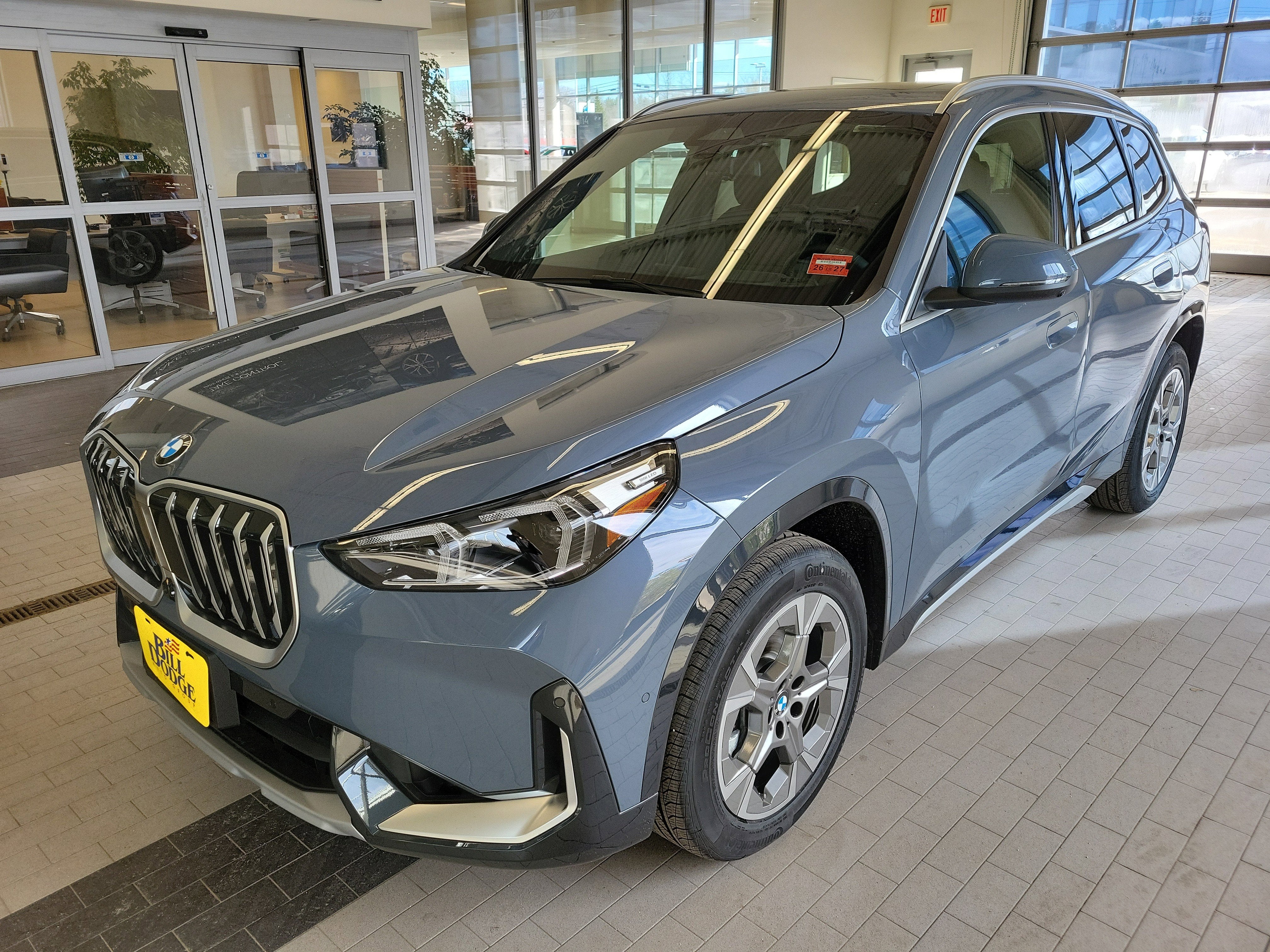 2026 BMW X1 xDrive28i in Storm Bay Metallic — front three-quarter view