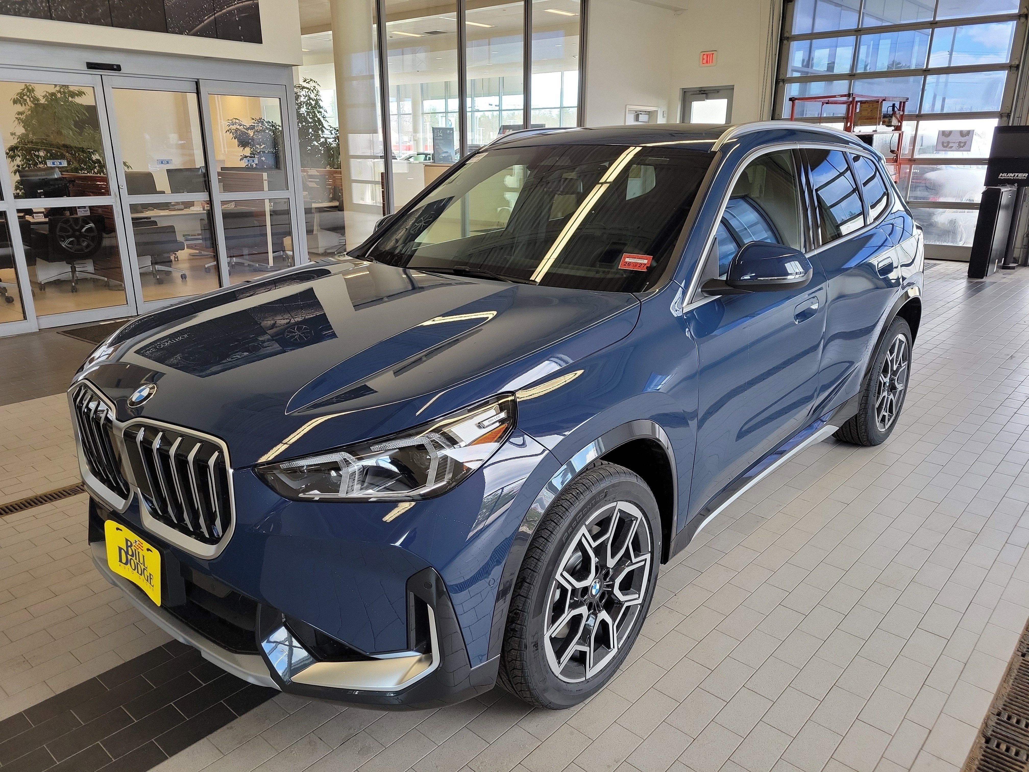 2026 BMW X1 xDrive28i in Night Dusk Blue Metallic — front three-quarter view