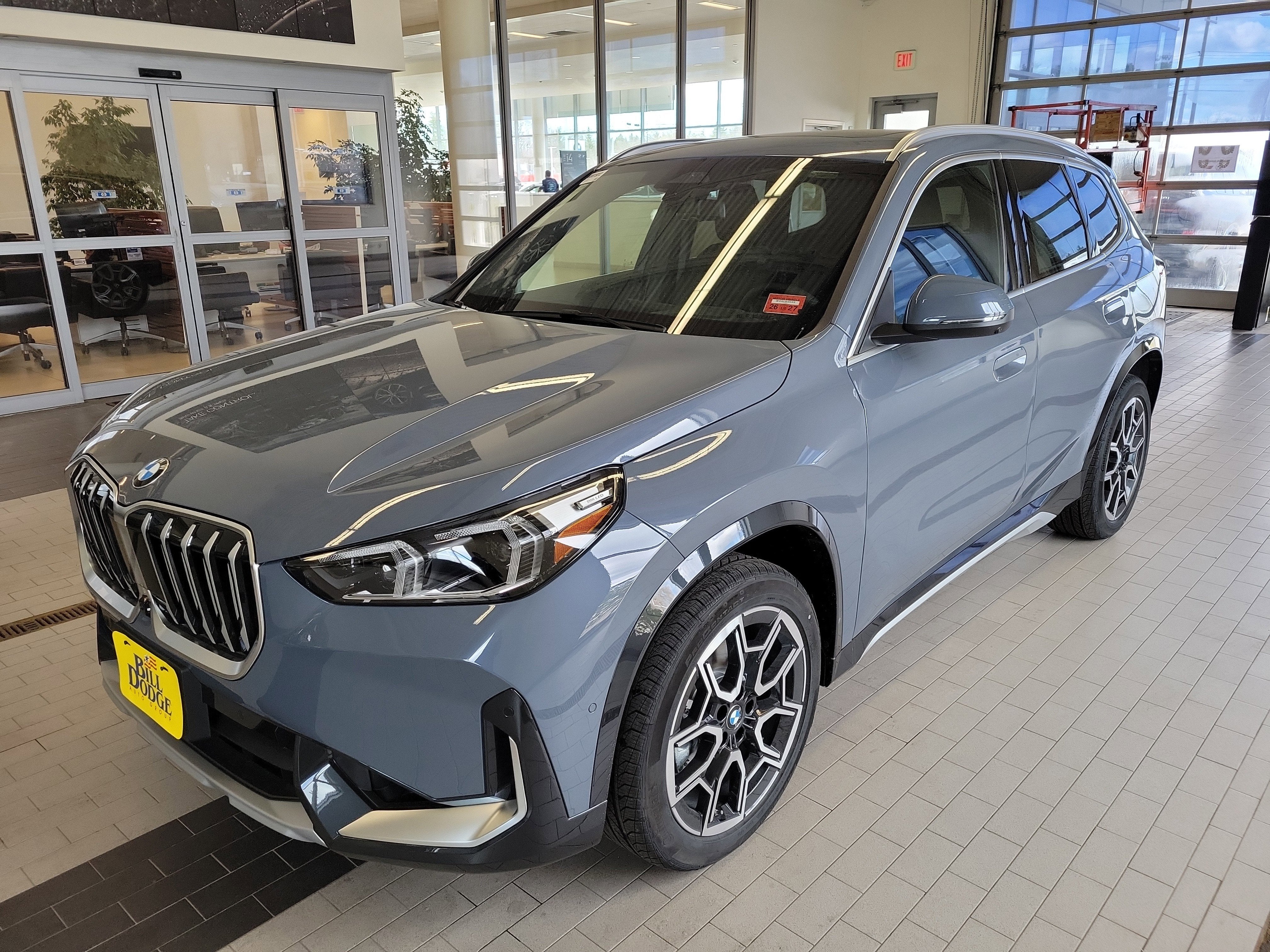 2026 BMW X1 xDrive28i in Storm Bay Metallic — front three-quarter view