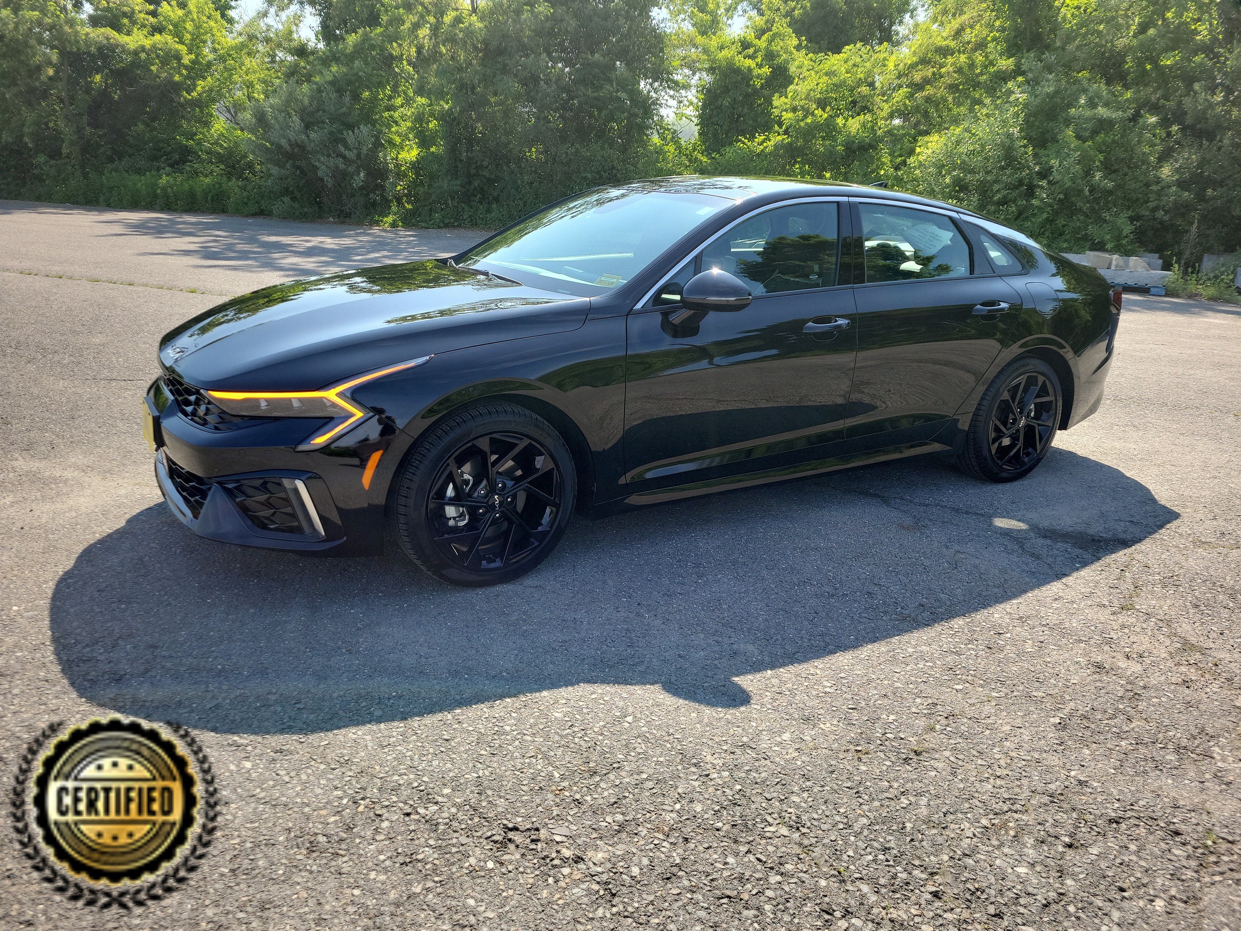 2026 Kia K5 GT-Line in Aurora Black Pearl — front three-quarter view
