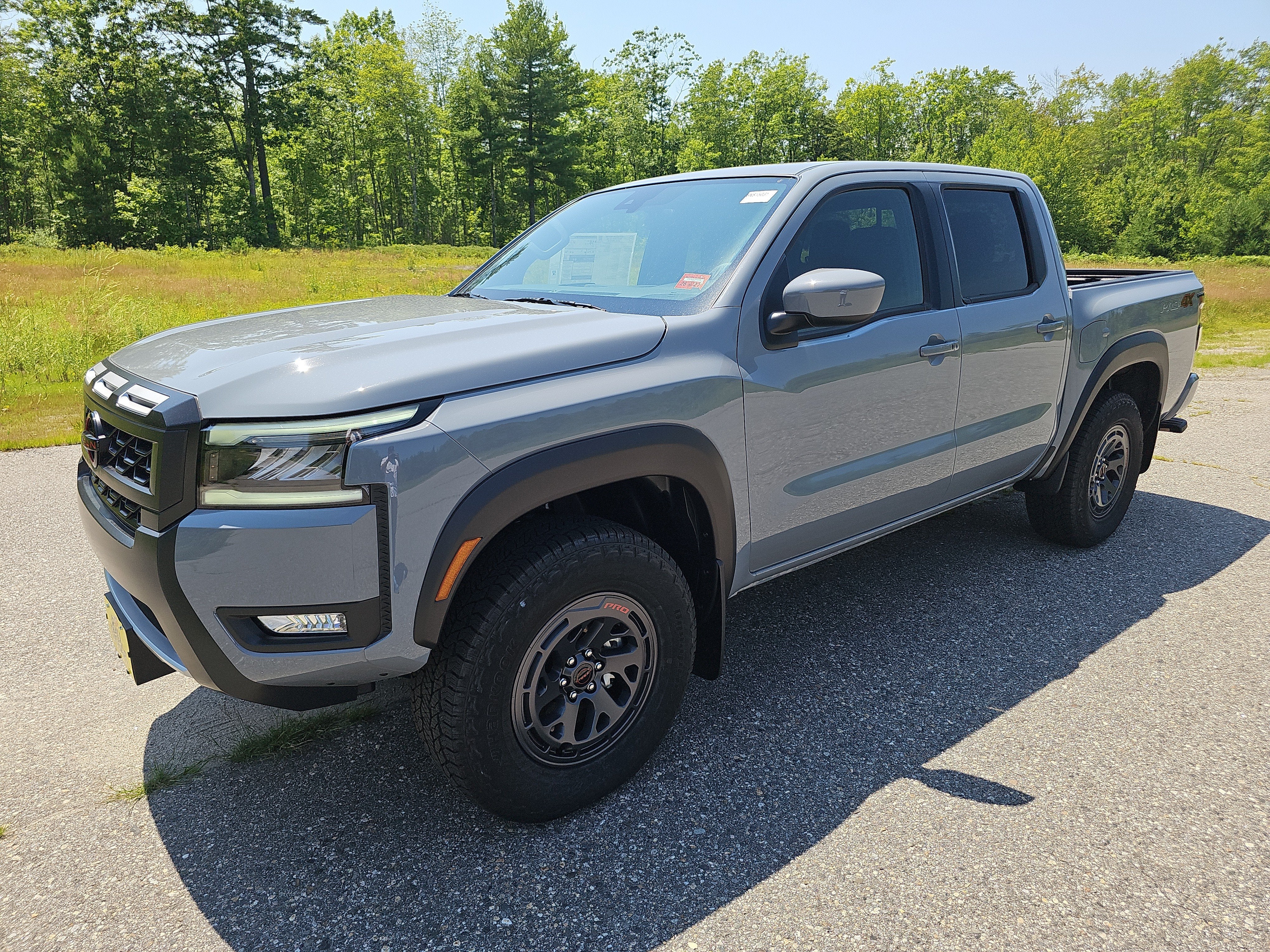 2026 Nissan Frontier PRO-4X in Boulder Gray Pearl — front three-quarter view