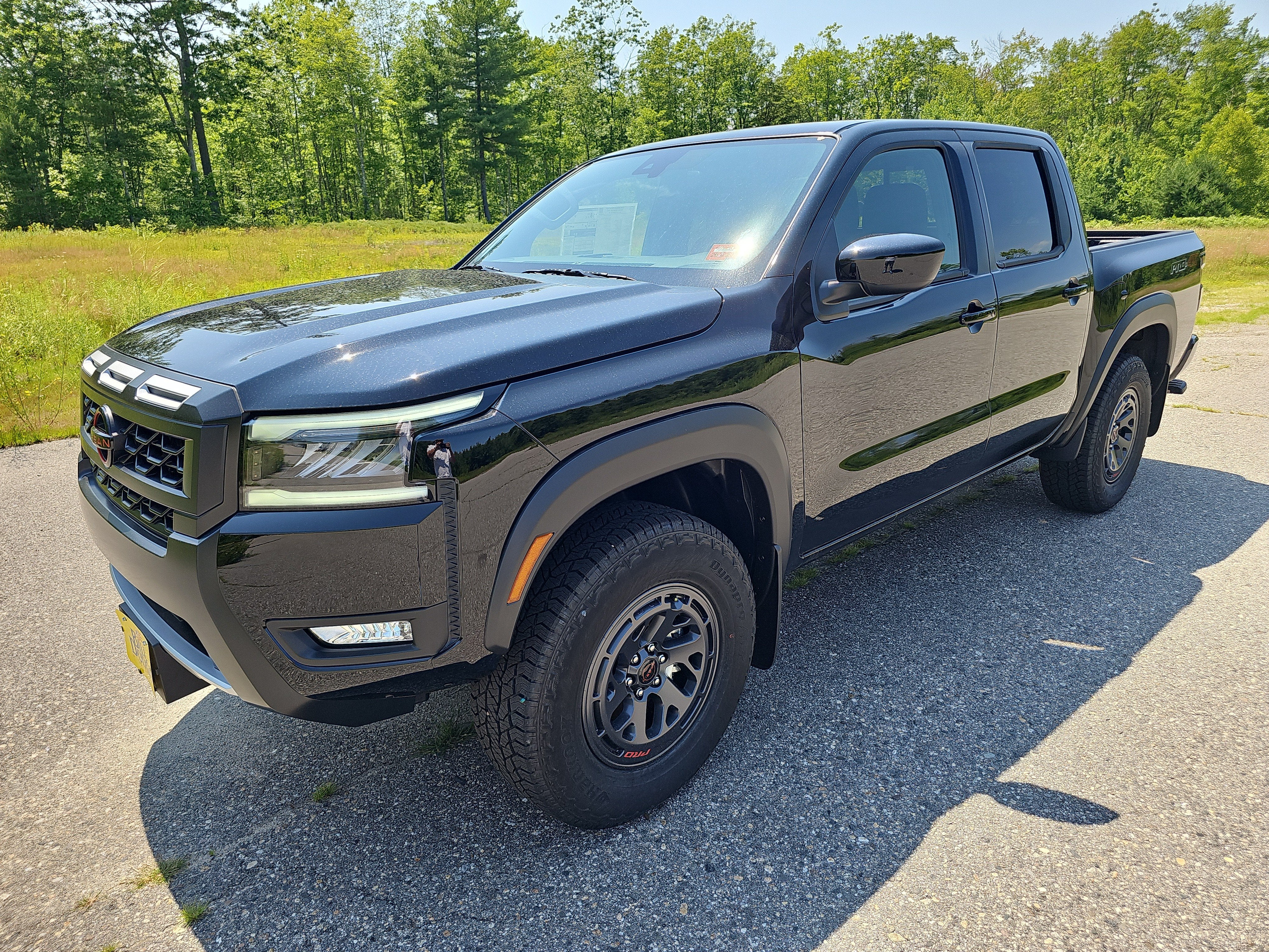 2026 Nissan Frontier PRO-4X in Super Black — front three-quarter view