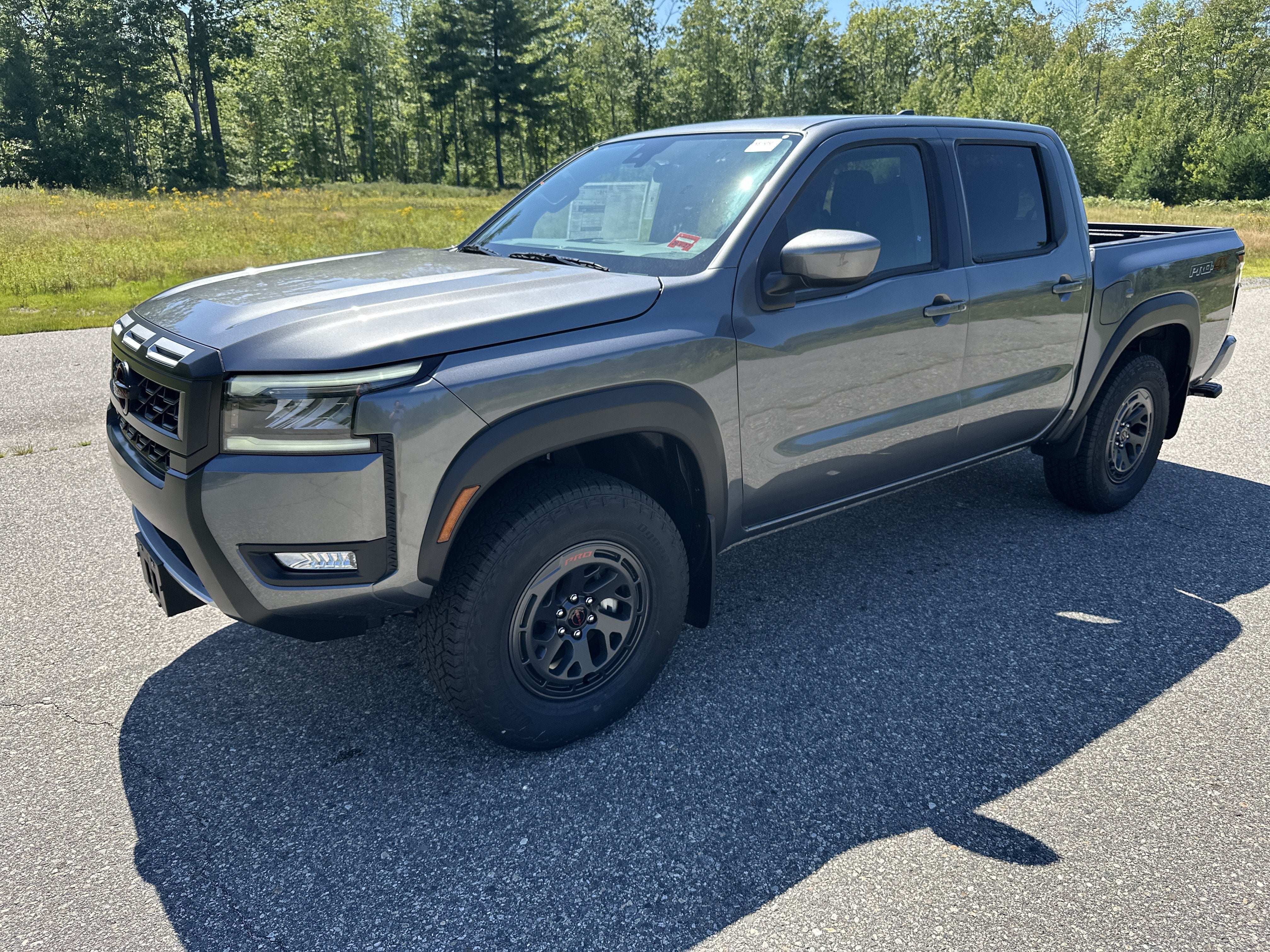 2026 Nissan Frontier PRO-4X in Gun Metallic — front three-quarter view
