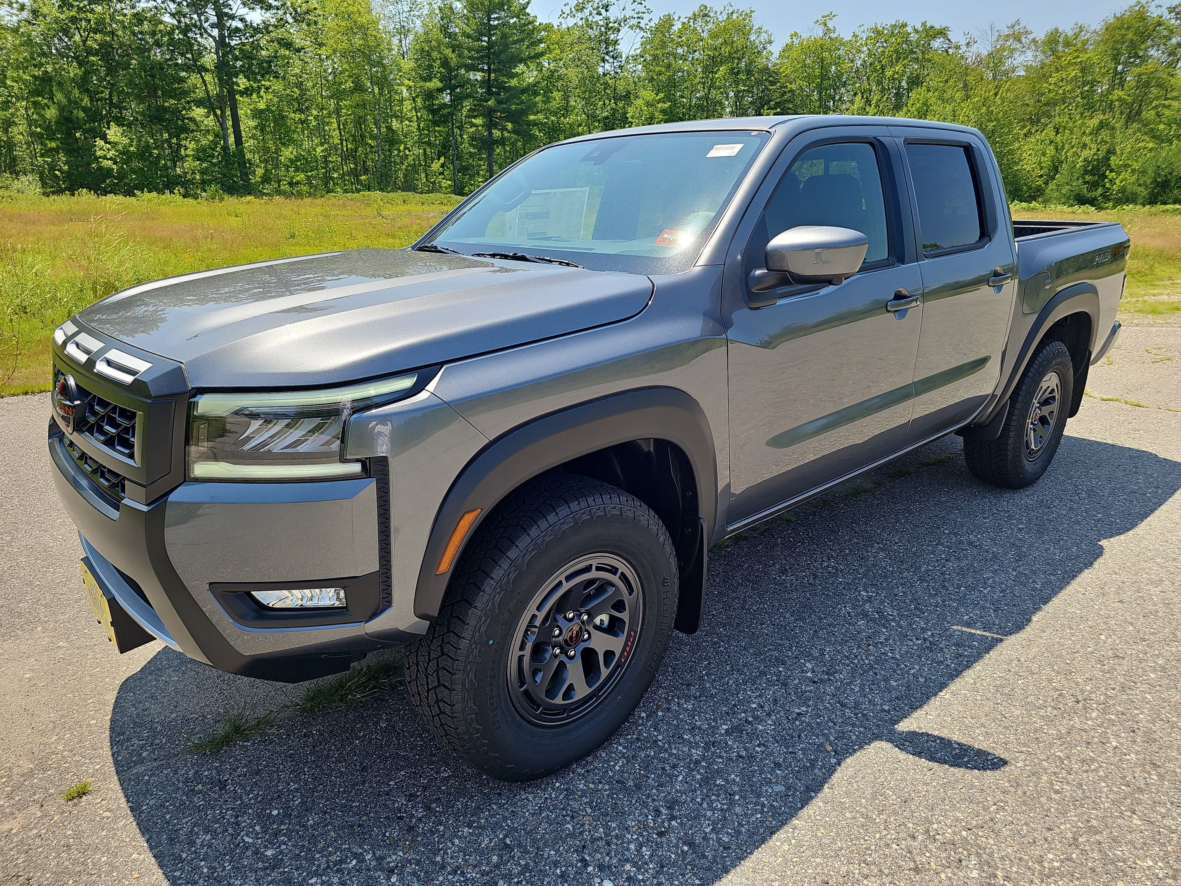 2026 Nissan Frontier PRO-4X in Gun Metallic — front three-quarter view