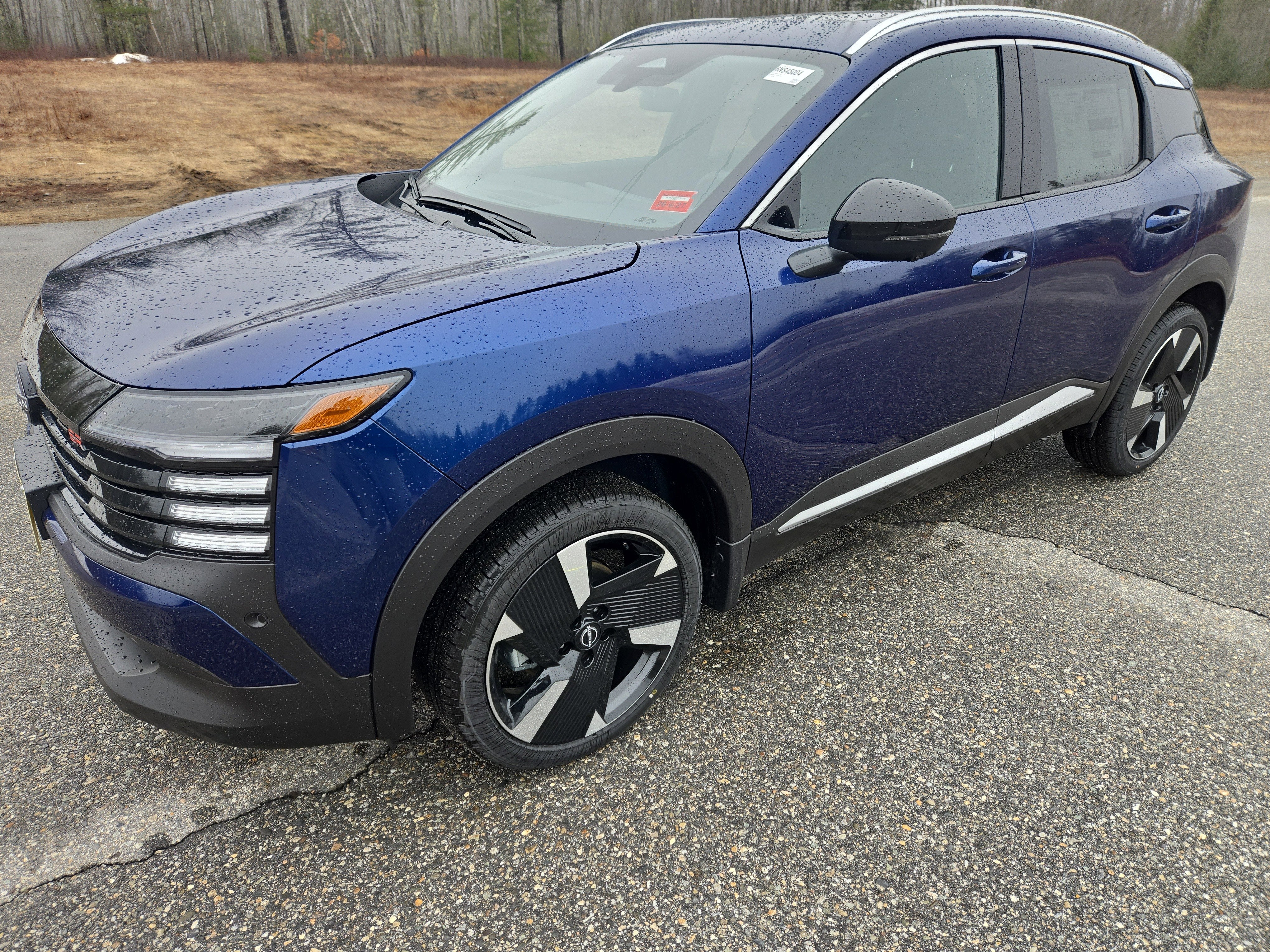 2026 Nissan Kicks SR in Deep Blue Pearl — front three-quarter view