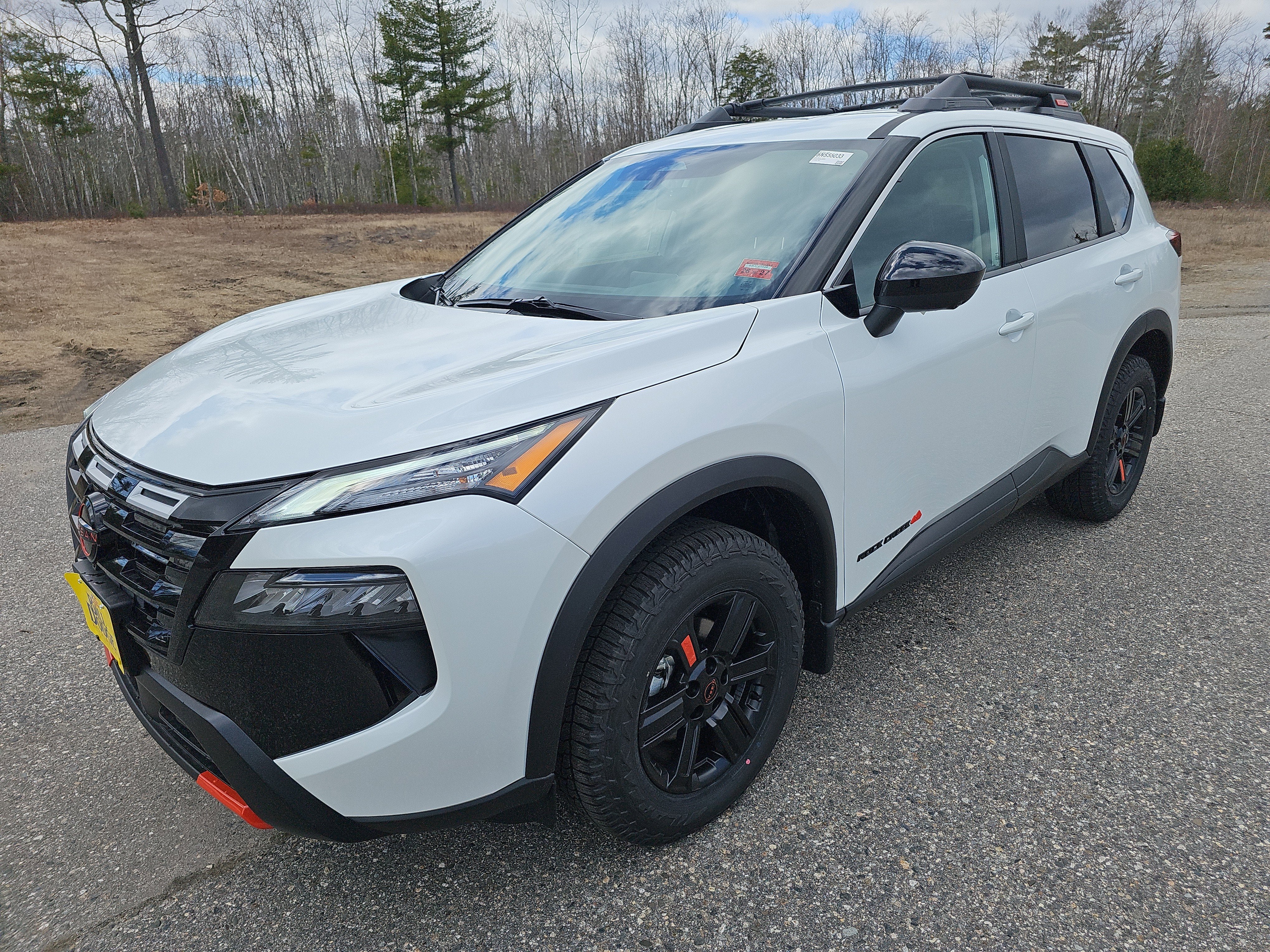 2026 Nissan Rogue Rock Creek in Everest White Pearl Tricoat — front three-quarter view