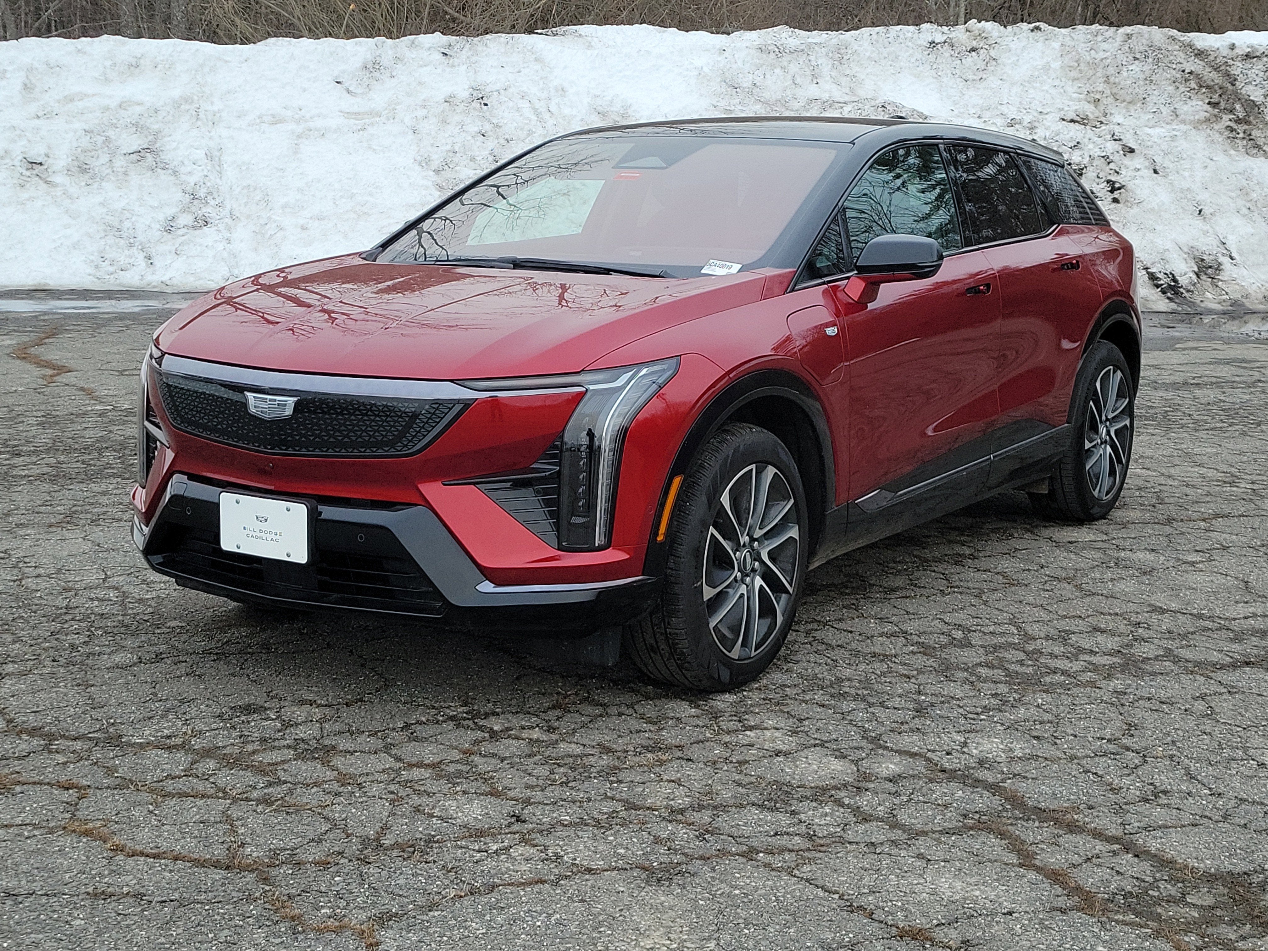 2026 Cadillac OPTIQ Sport in Radiant Red Tintcoat — front three-quarter view