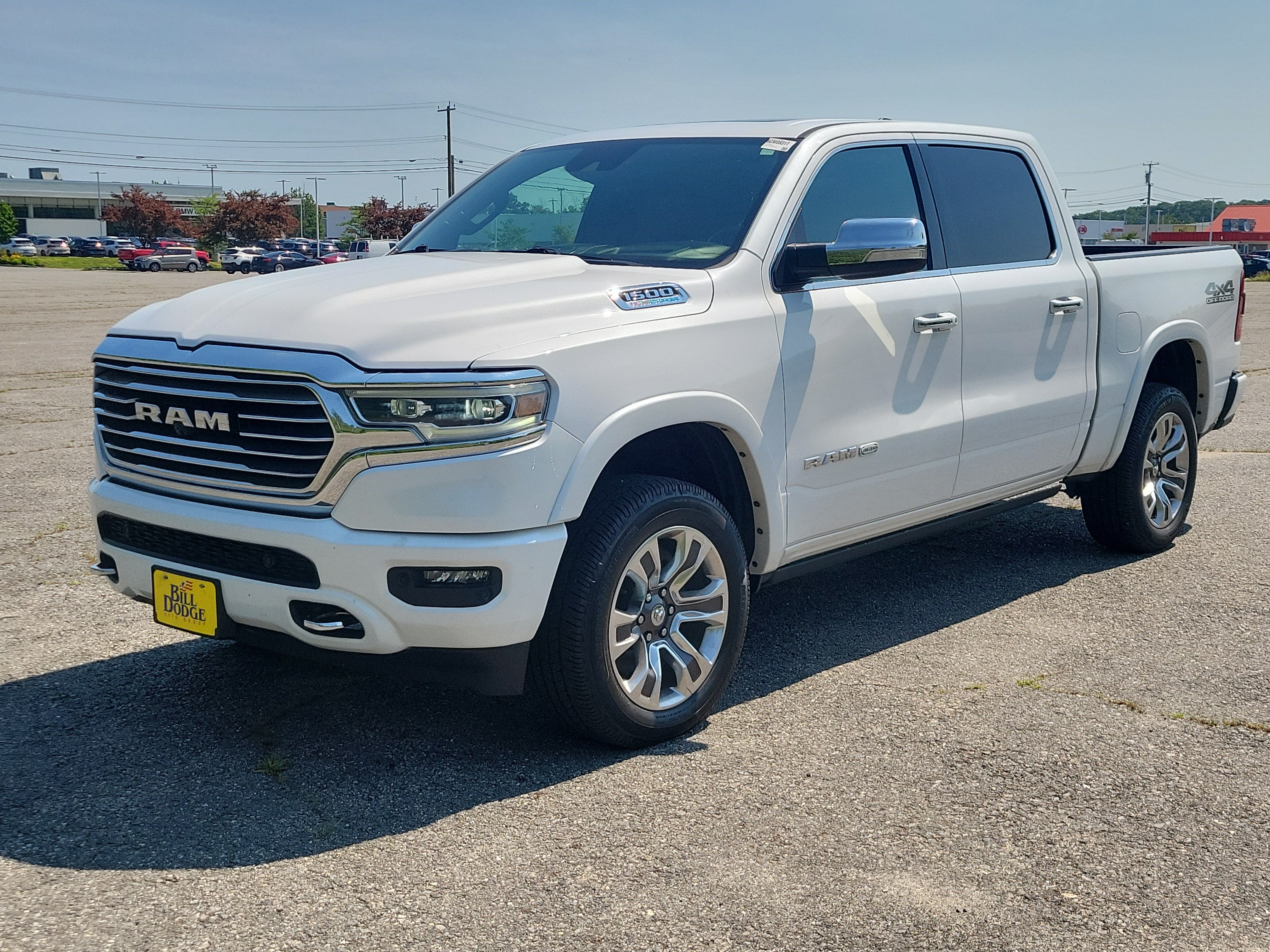 2021 RAM 1500 Longhorn in Ivory White Tri-Coat Pearlcoat — front three-quarter view