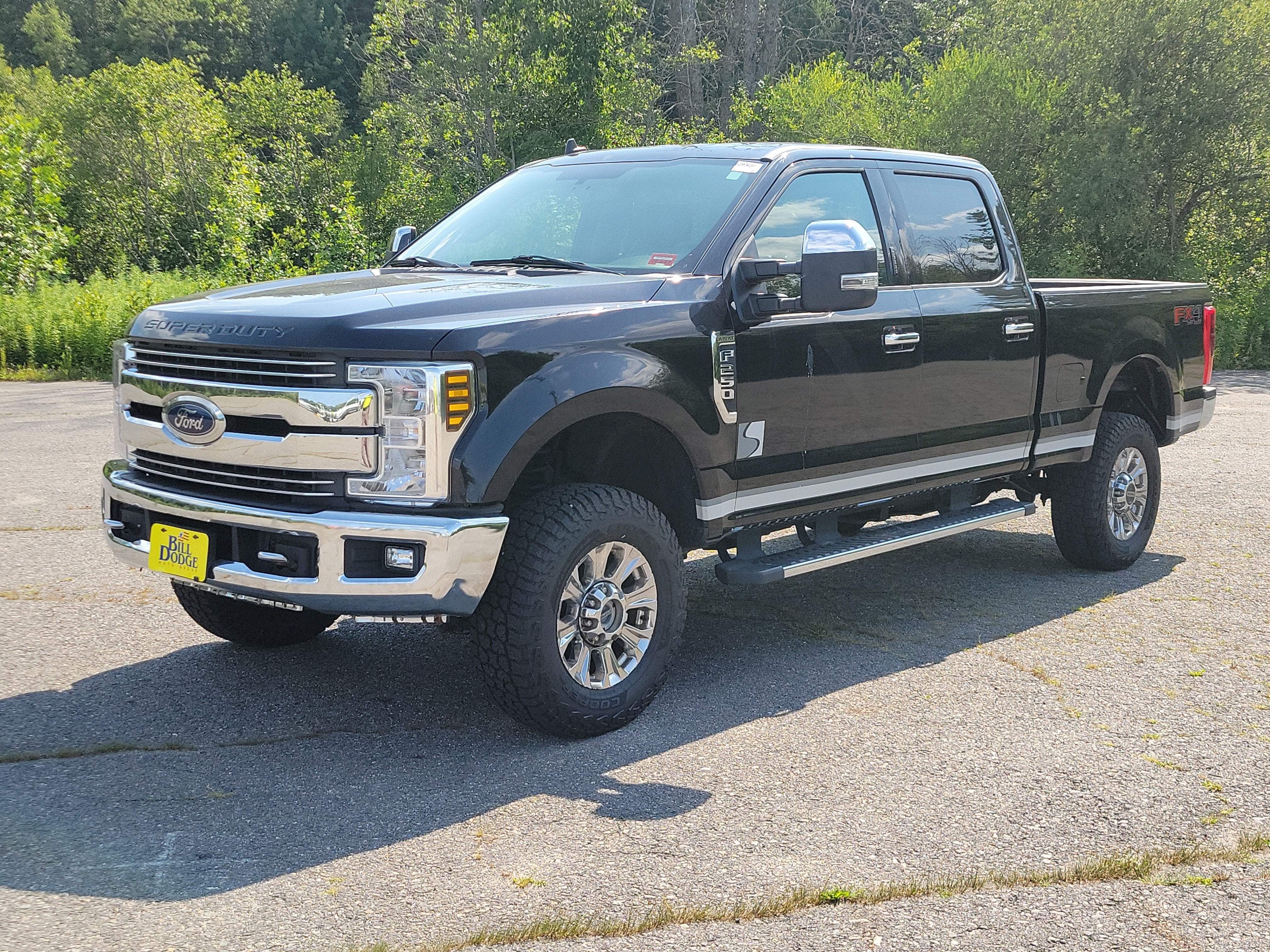 2019 Ford F-250 LARIAT in Black — front three-quarter view