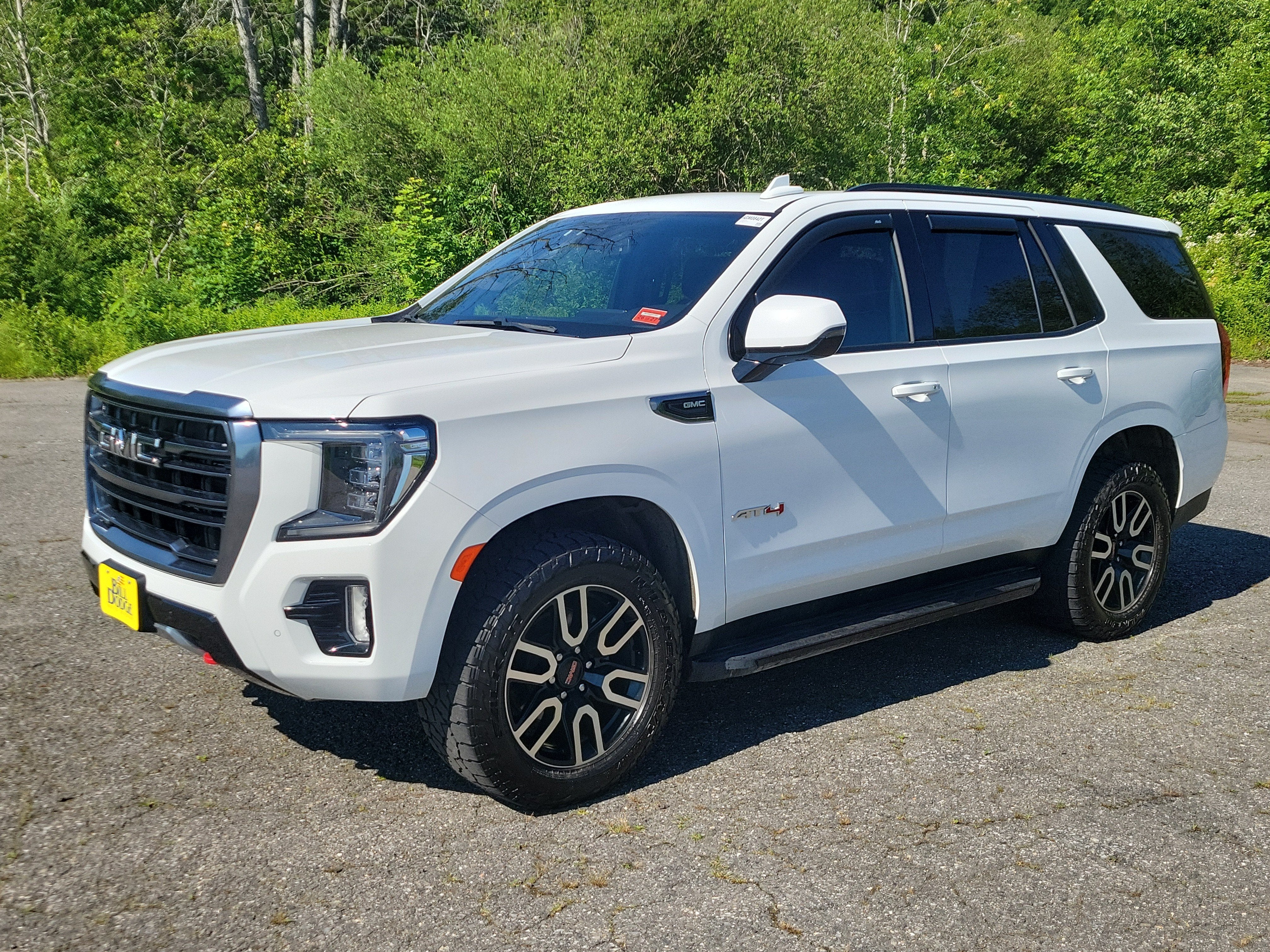 2022 GMC Yukon AT4 in Summit White — front three-quarter view