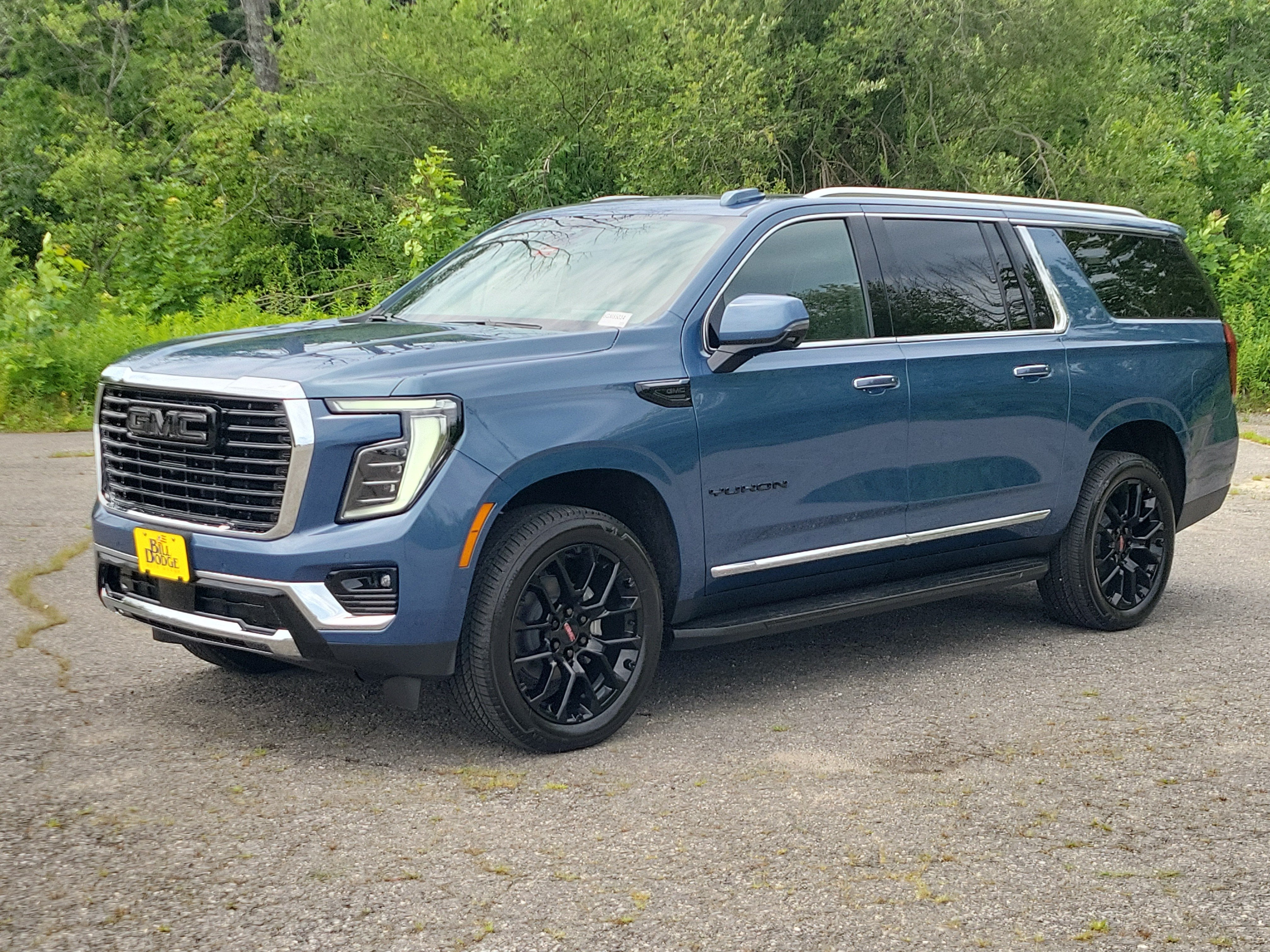 2026 GMC Yukon XL Elevation in Downpour Metallic — front three-quarter view
