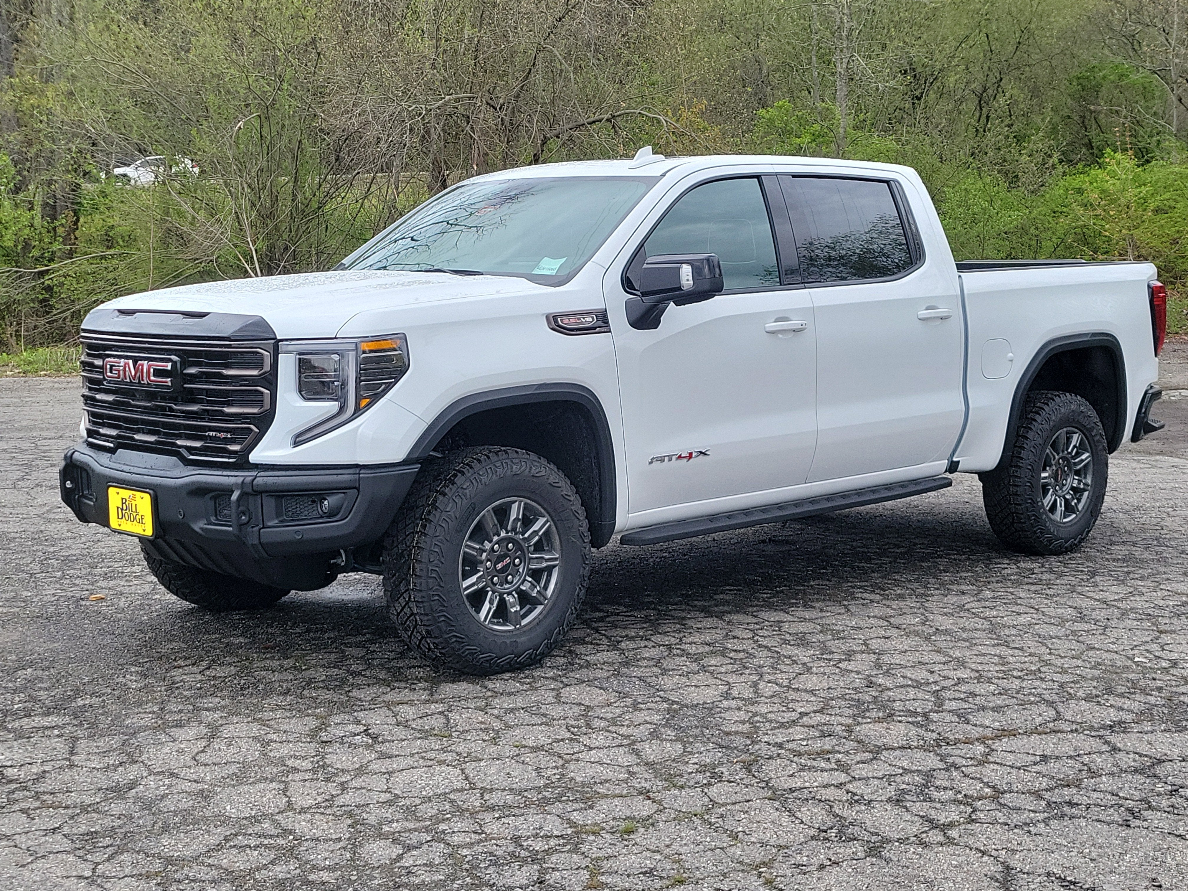 2026 GMC Sierra 1500 AT4X in Summit White — front three-quarter view