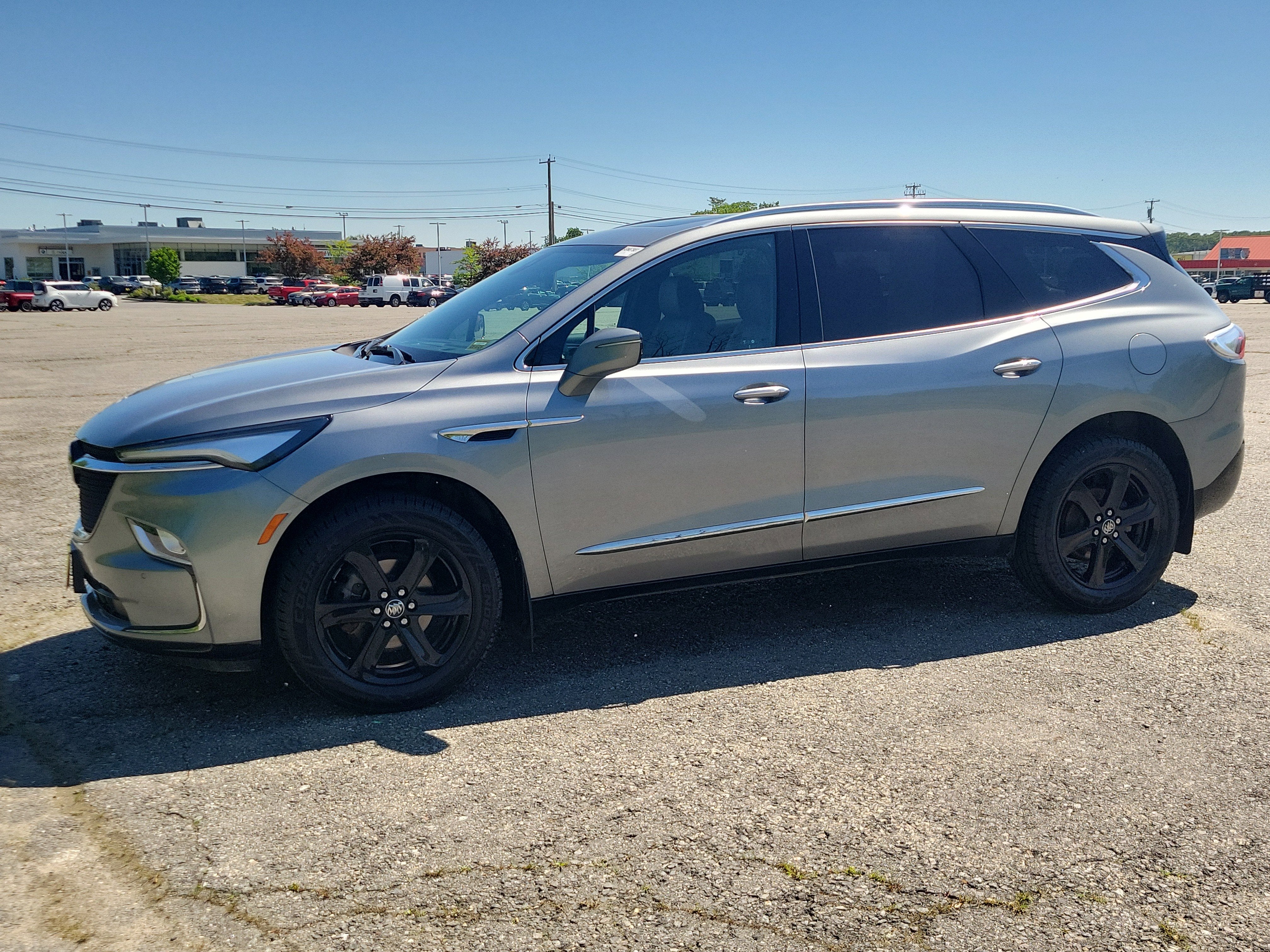 2023 Buick Enclave Essence in Moonstone Gray Metallic — front three-quarter view