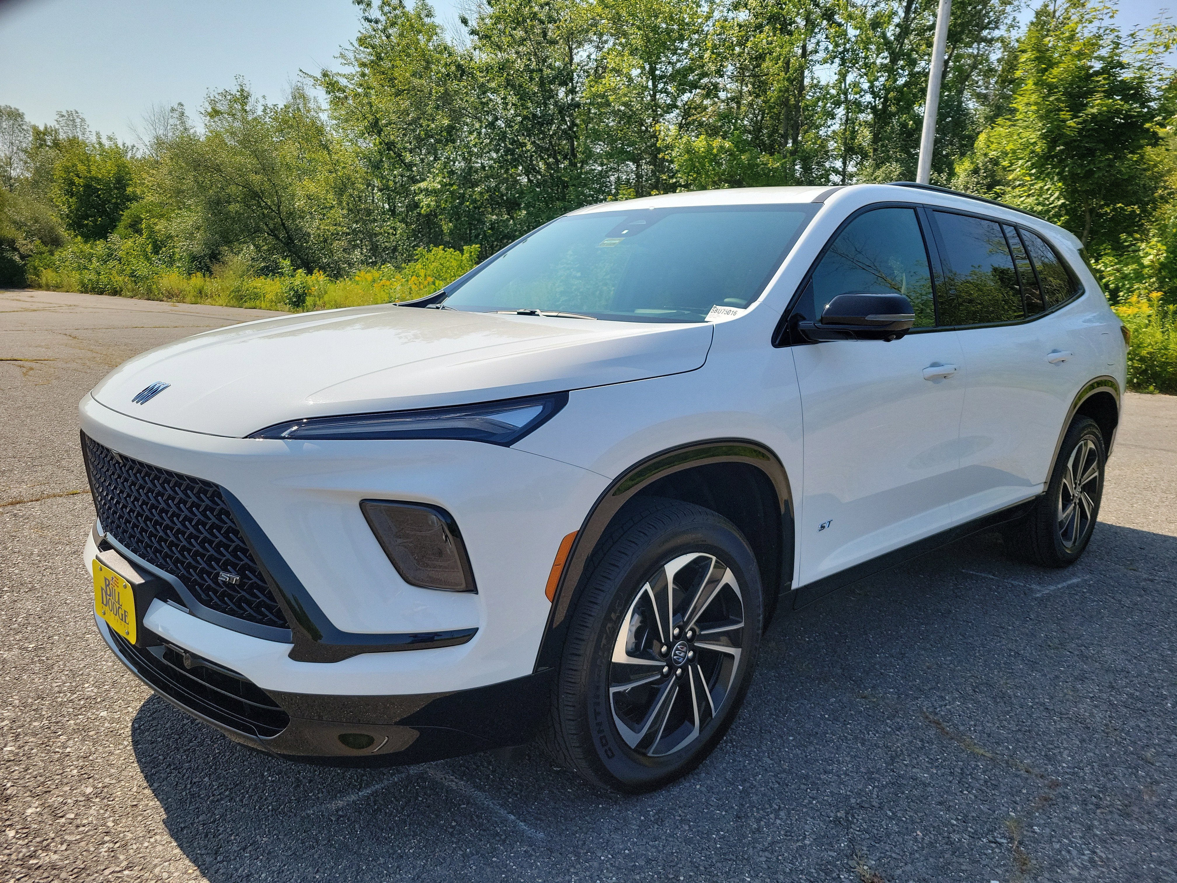 2026 Buick Enclave Sport Touring in Summit White — front three-quarter view