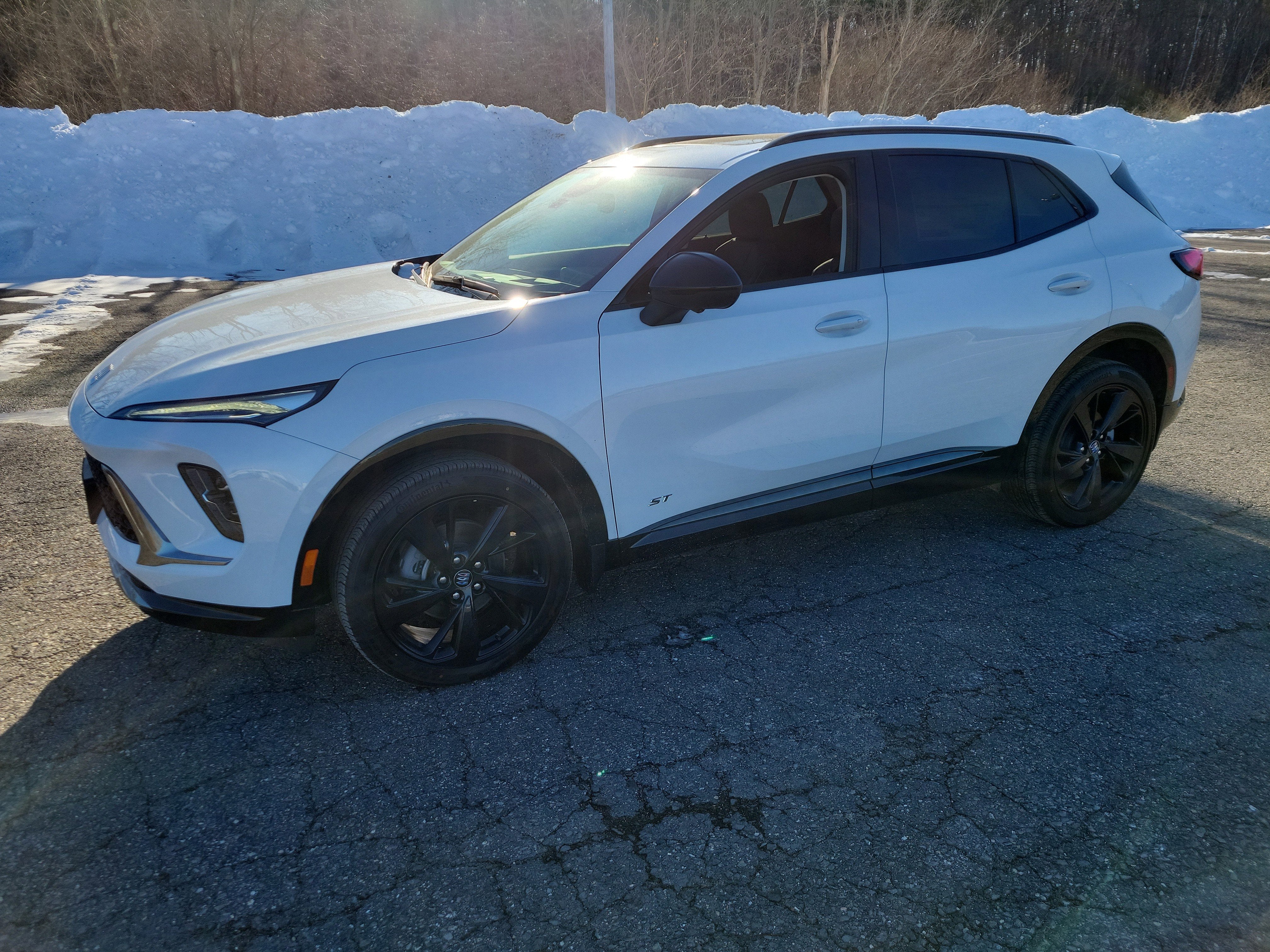 2026 Buick Envision Sport Touring in Iridescent White Tricoat — front three-quarter view
