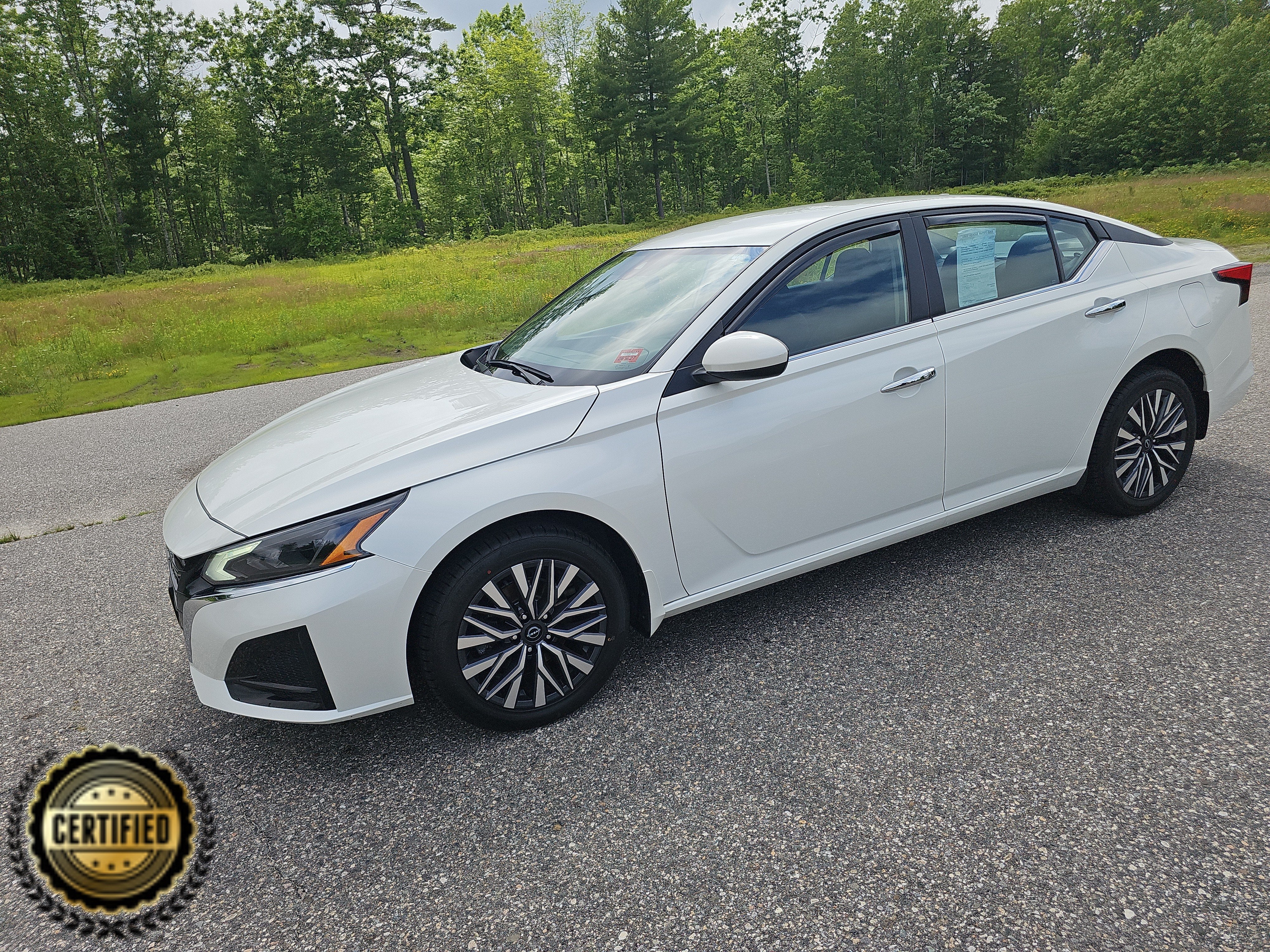 2023 Nissan Altima 2.5 SV in Pearl White Tricoat — front three-quarter view