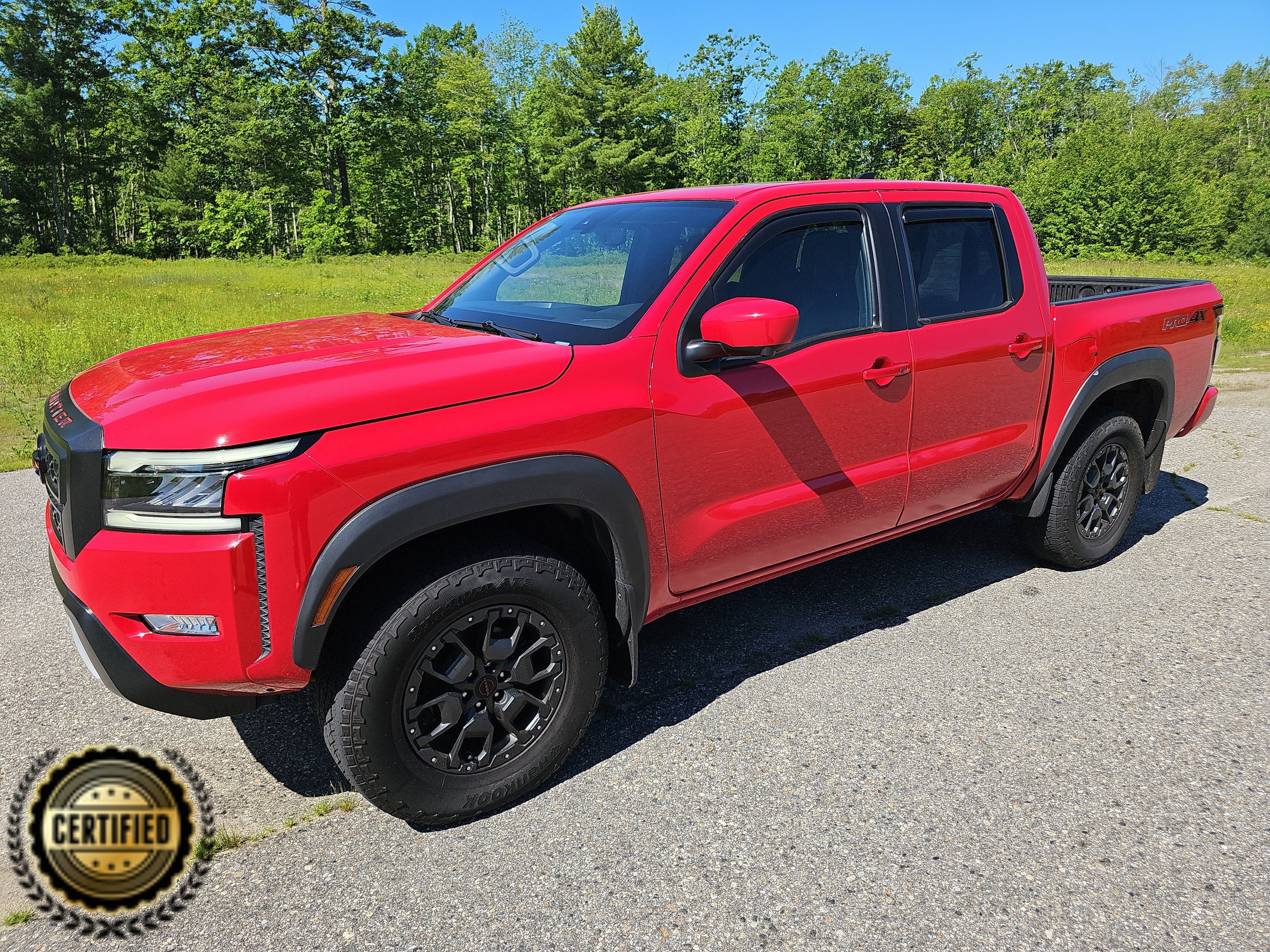 2023 Nissan Frontier Crew Cab PRO-4X in Red Alert — front three-quarter view