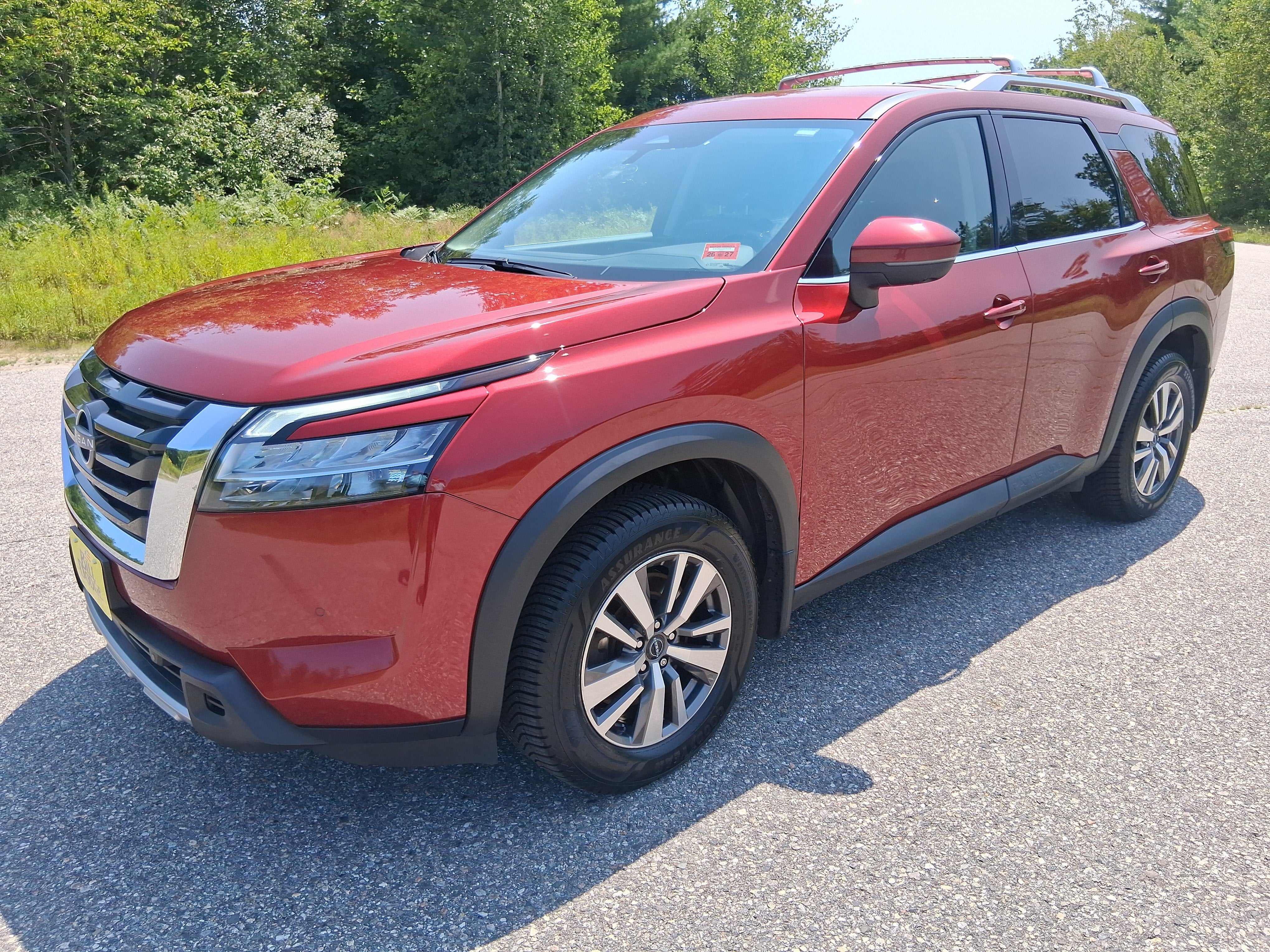 2023 Nissan Pathfinder SL in Scarlet Ember Tintcoat — front three-quarter view
