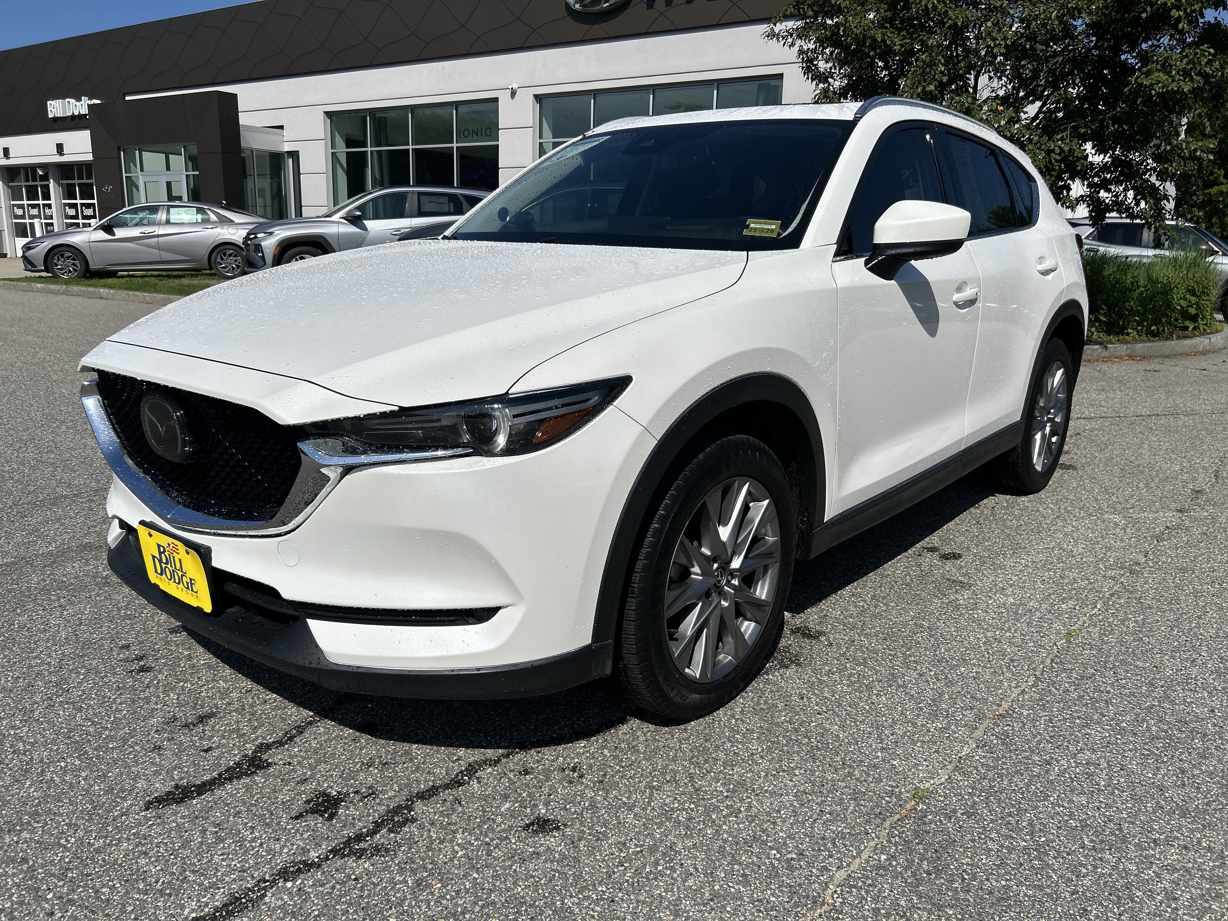 2021 Mazda Mazda CX-5 Grand Touring in Snowflake White Pearl Mica — front three-quarter view